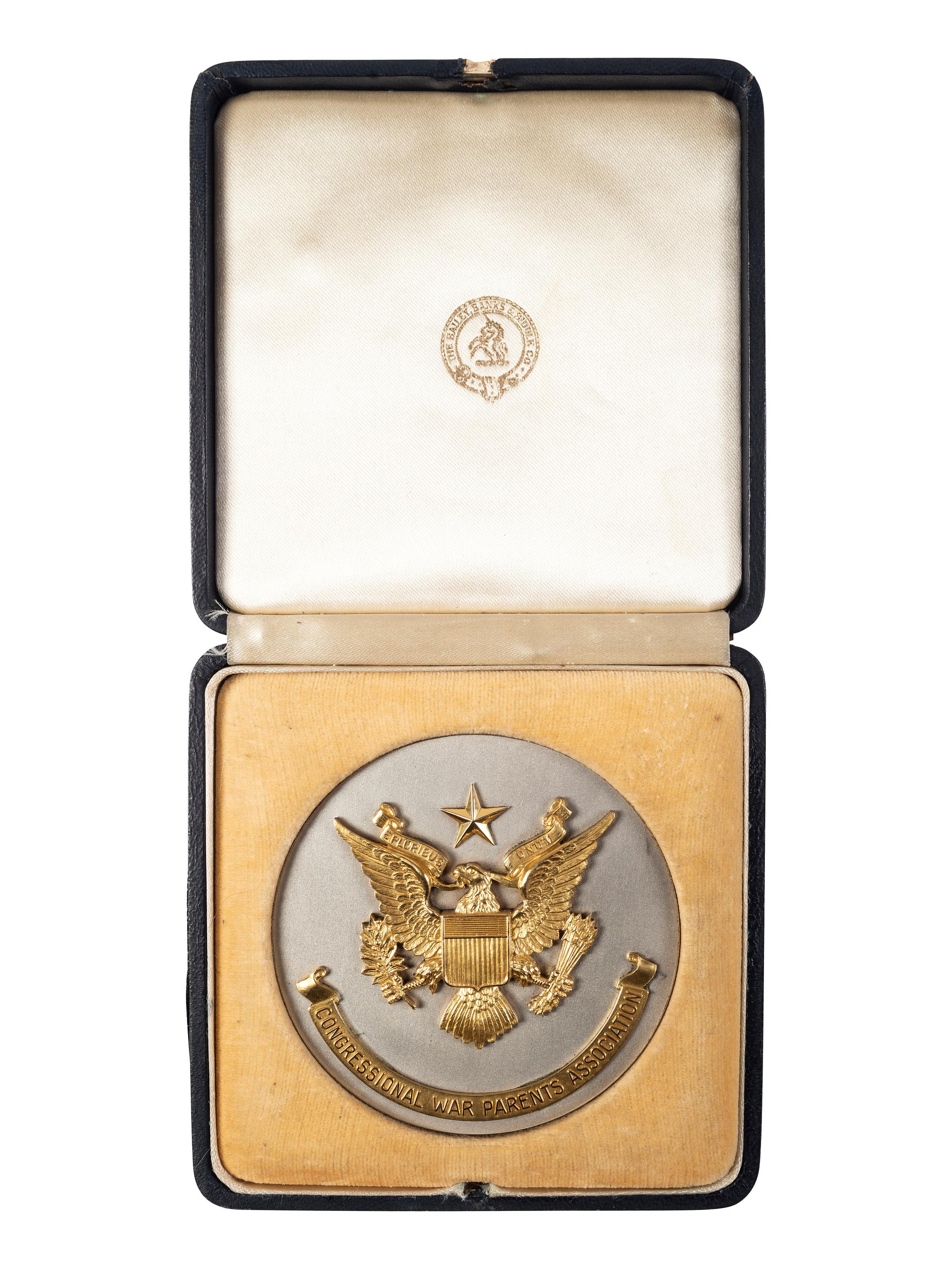 [WORLD WAR II]. A group of 3 items, highlighted by "Congressional War Parents Association" medallion presented to Ellsworth B. Buck for the loss of his son, 1st Lieutenant Orlando J. Buck.
