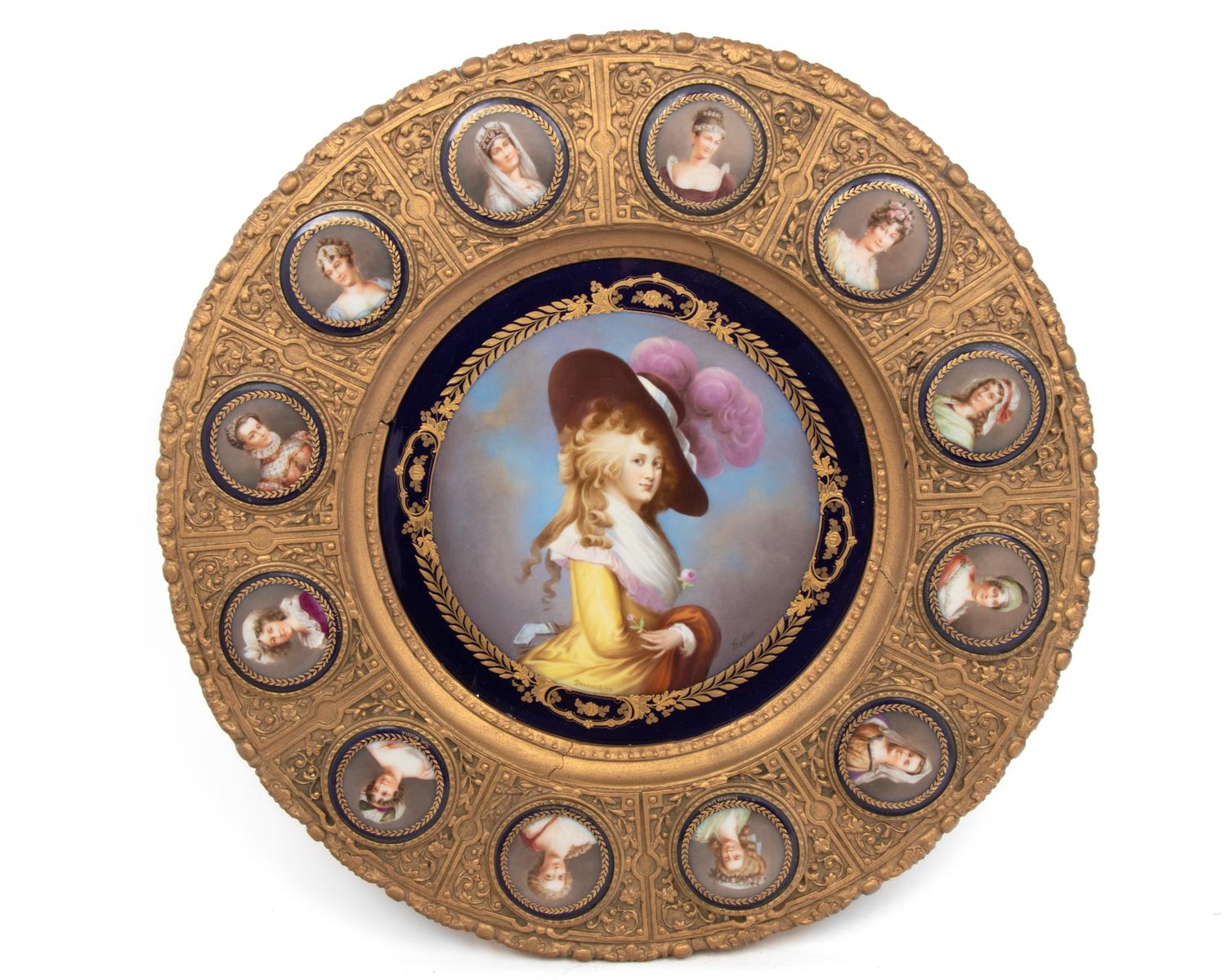 A Continental Porcelain Portrait and a Set of Twelve Similar Medallions in a Gilt Bronze Plaque