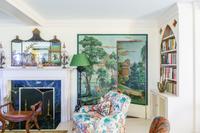 A Painted Wrought Iron Torchère Mounted as a Floor Lamp