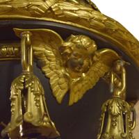 A Pair of Bronze Chandeliers with Cherub Masks 24" W x 24" D x 58" H — United States, Circa 1900