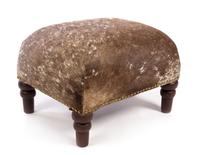 A Cowhide Upholstered Foot Stool Height 13 1/4 inches.