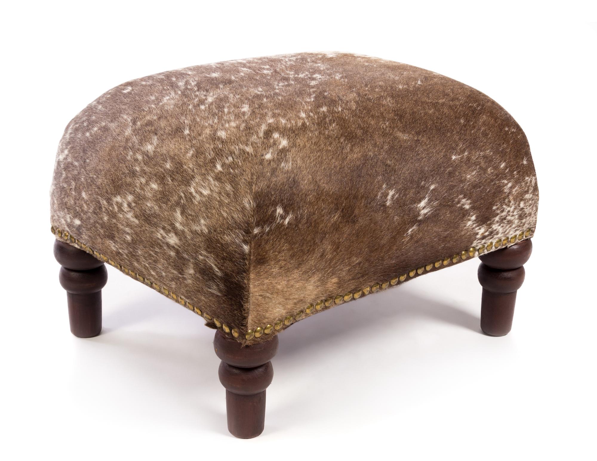 A Cowhide Upholstered Foot Stool Height 13 1/4 inches.