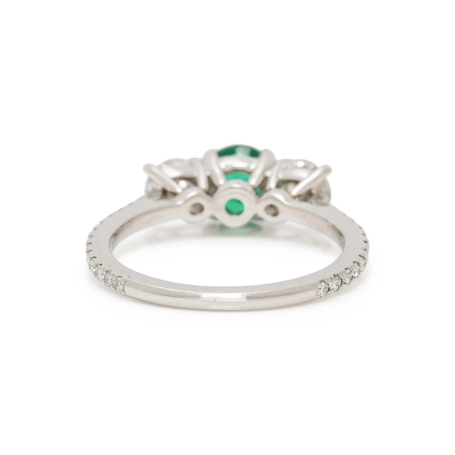 EMERALD, DIAMOND, AND PLATINUM RING