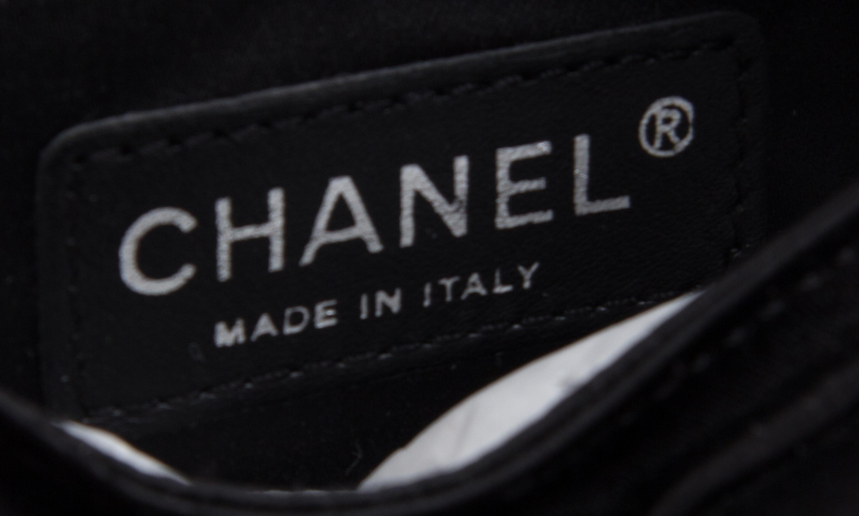 A Chanel Black Satin Partially Quilted Clutch, 11.5" x 5" x .5".