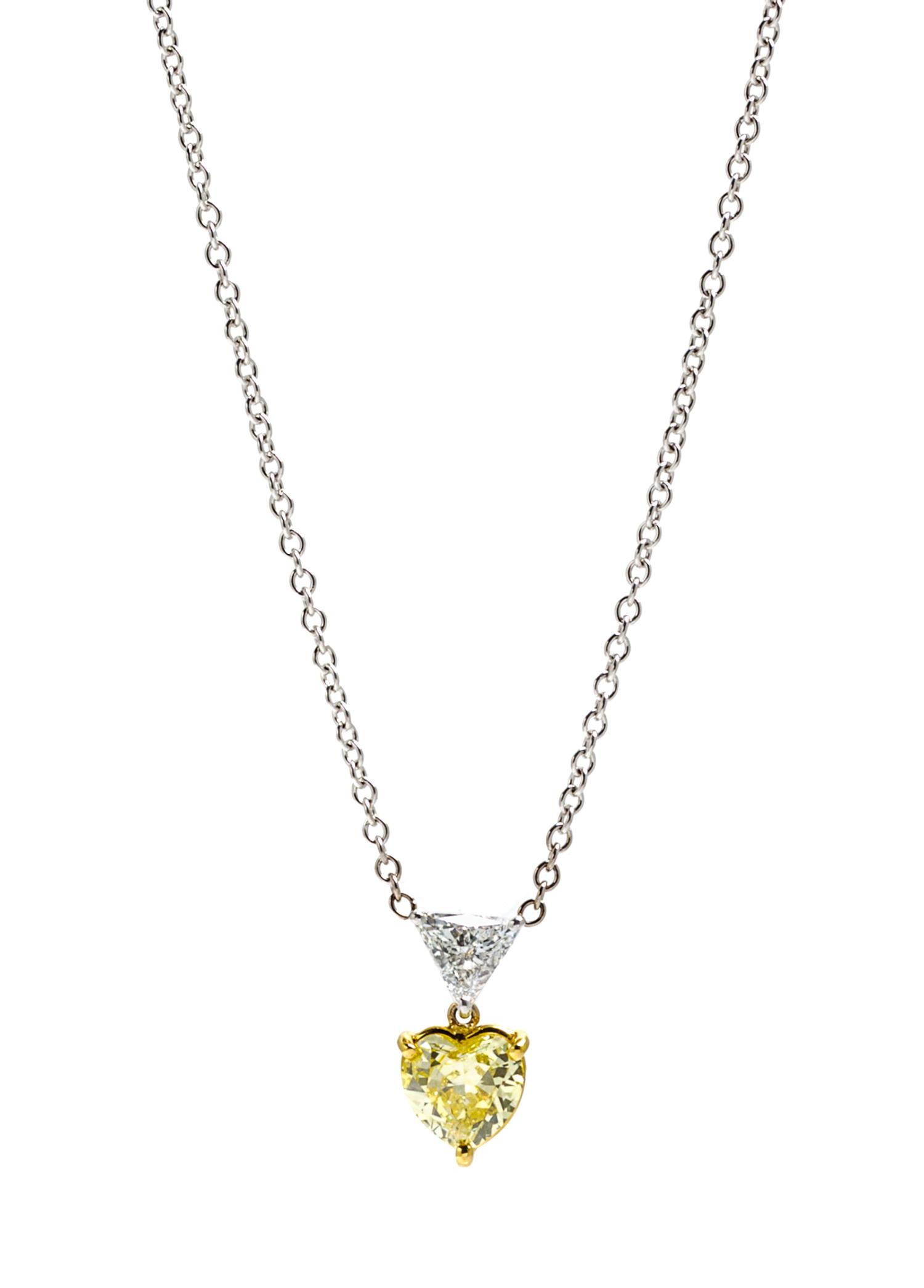 A Platinum, Gold, Fancy Colored Diamond and Diamond Pendant, 3.10 dwts.