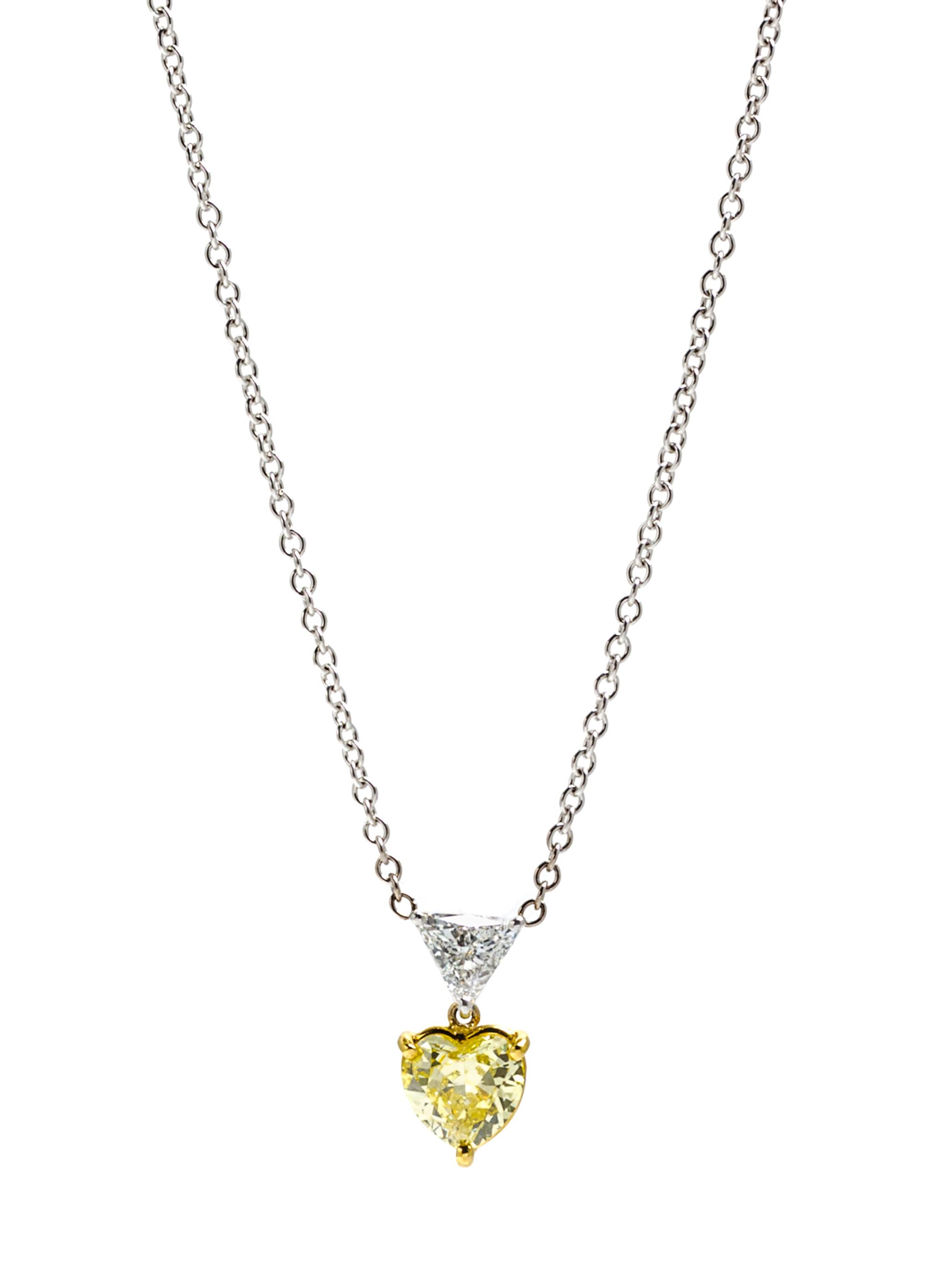 A Platinum, Gold, Fancy Colored Diamond and Diamond Pendant, 3.10 dwts.