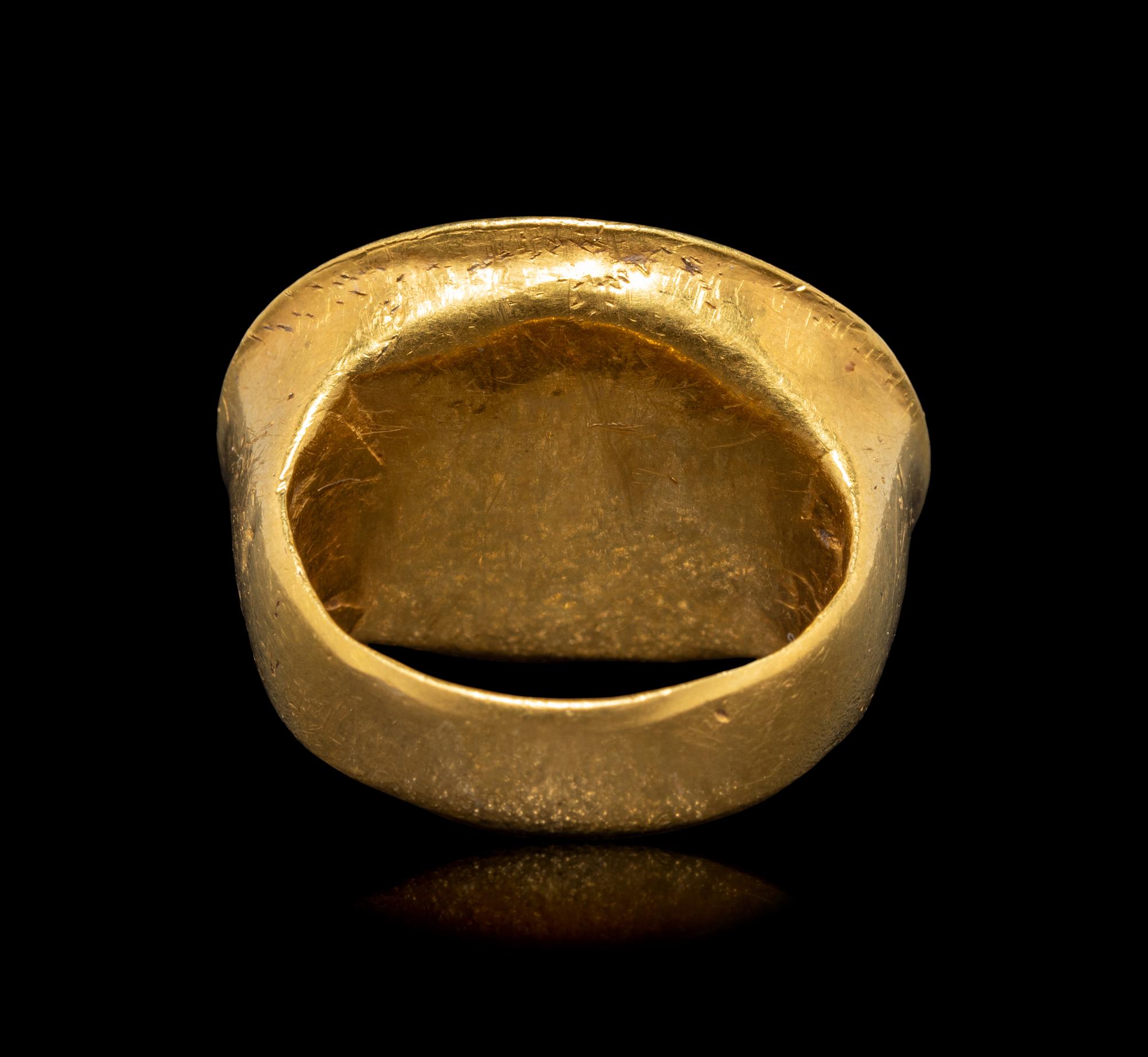 A Hellenistic Gold and Sard Finger Ring with the God Eros