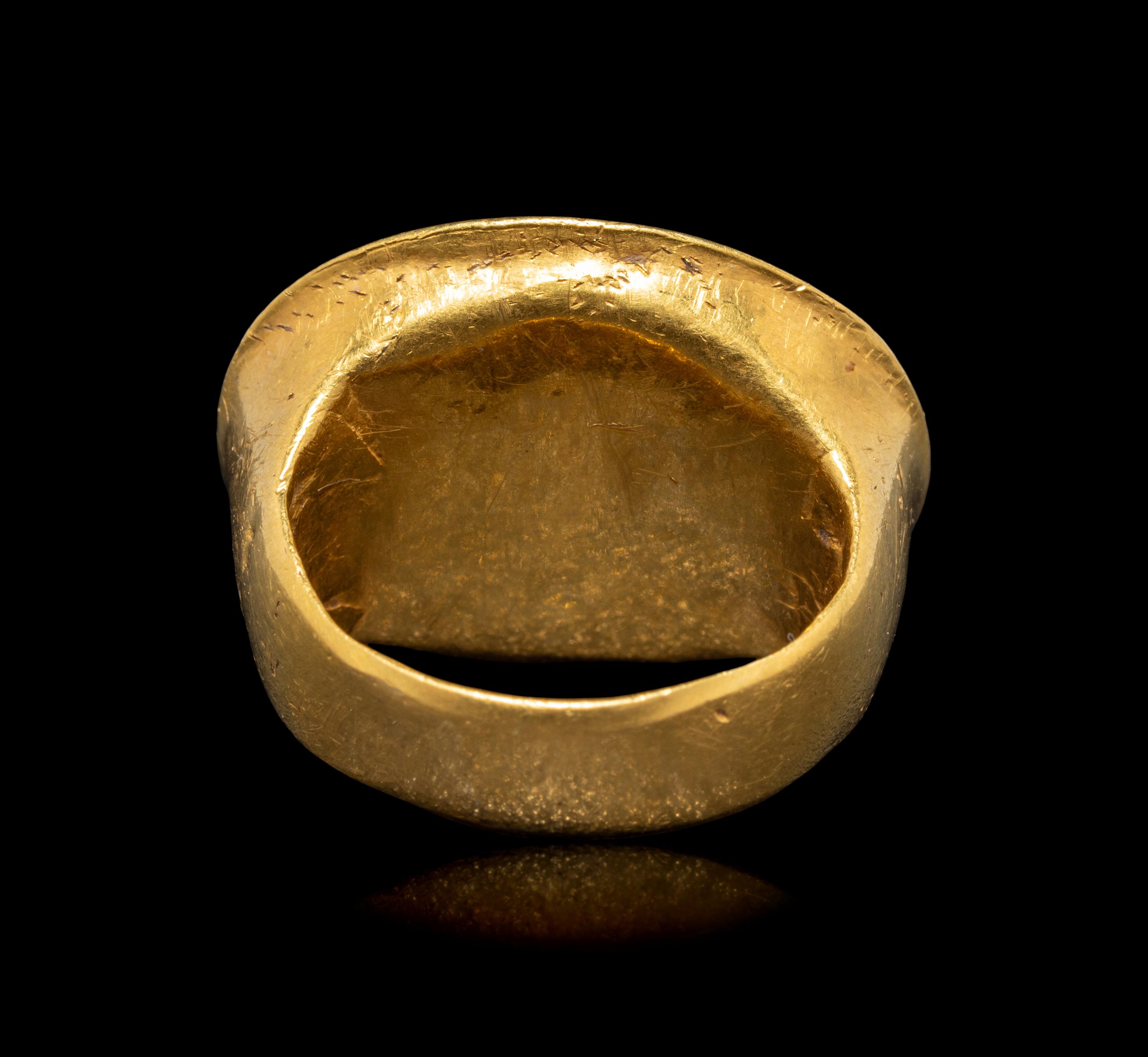 A Hellenistic Gold and Sard Finger Ring with the God Eros