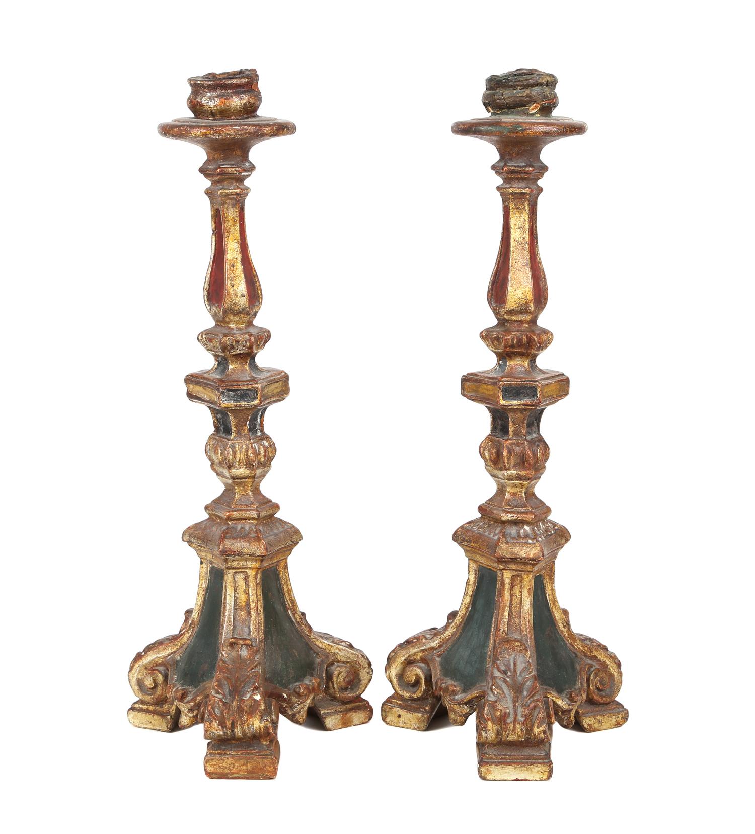 A Pair of Italian Carved and Painted Gilt Candlesticks Height 14 1/2 inches. — 20TH CENTURY