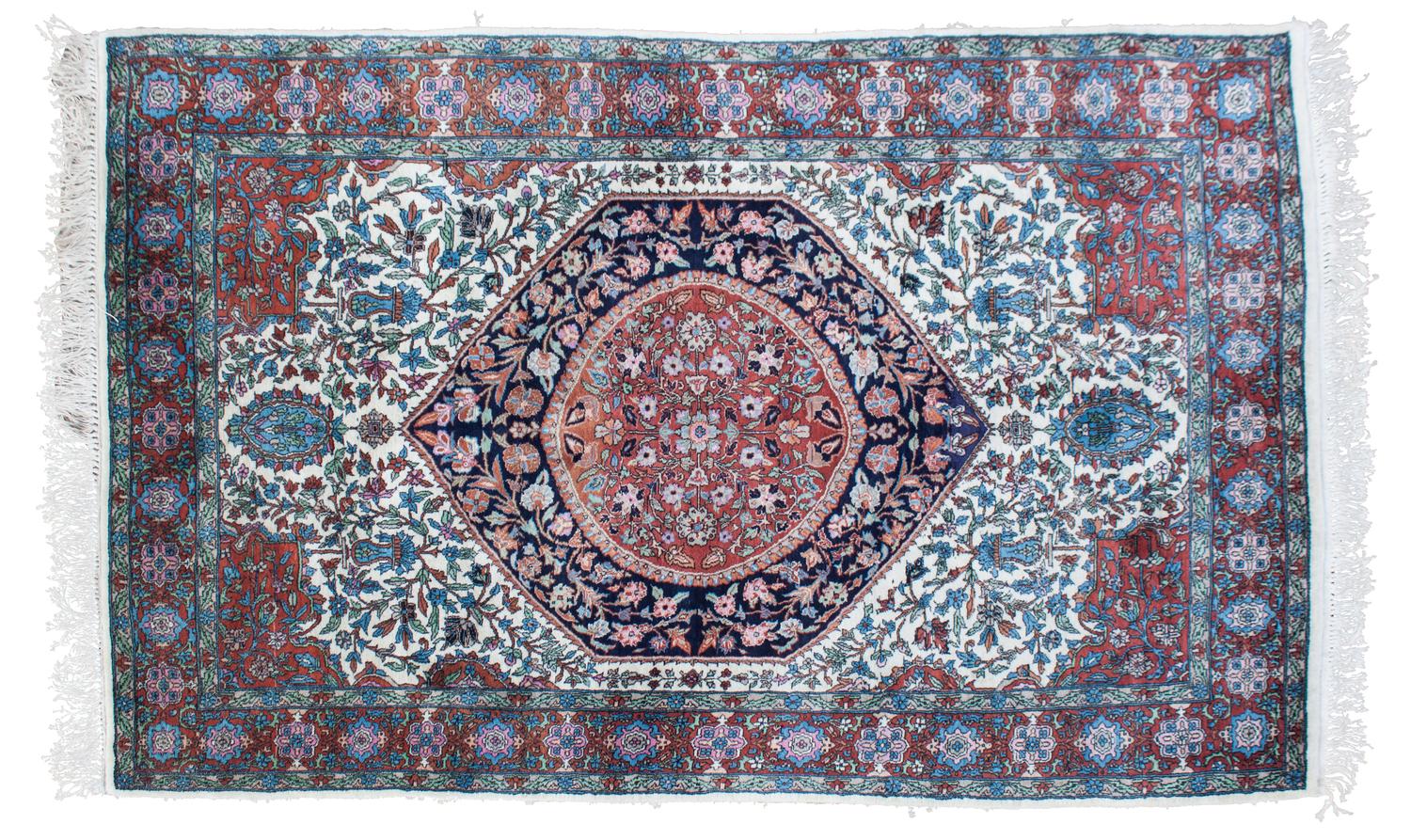 An Oriental Wool Rug 6 feet 4 inches x 4 feet.