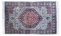 An Oriental Wool Rug 6 feet 4 inches x 4 feet.
