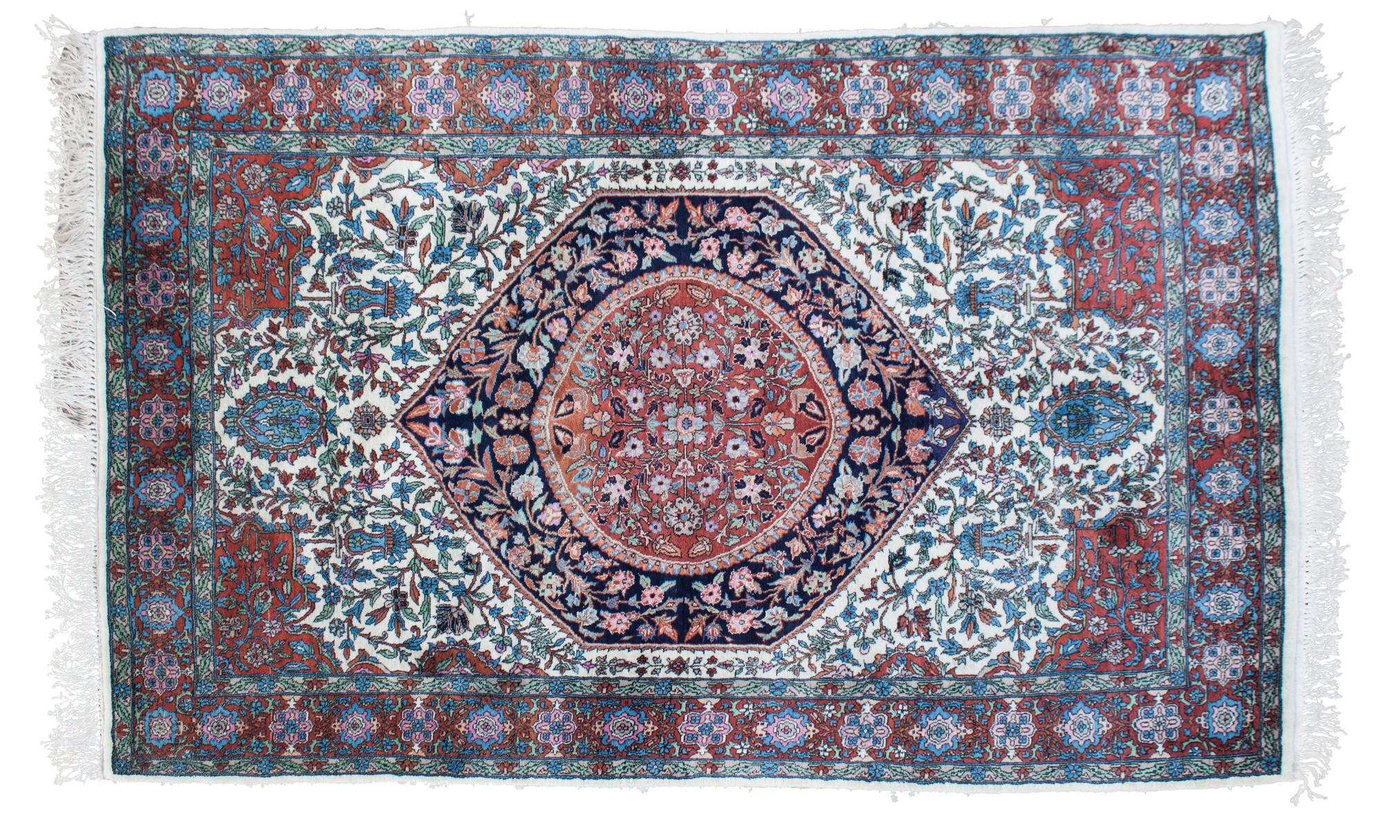 An Oriental Wool Rug 6 feet 4 inches x 4 feet.