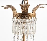 An Empire Style Bronze and Glass Twelve-Light Chandelier
