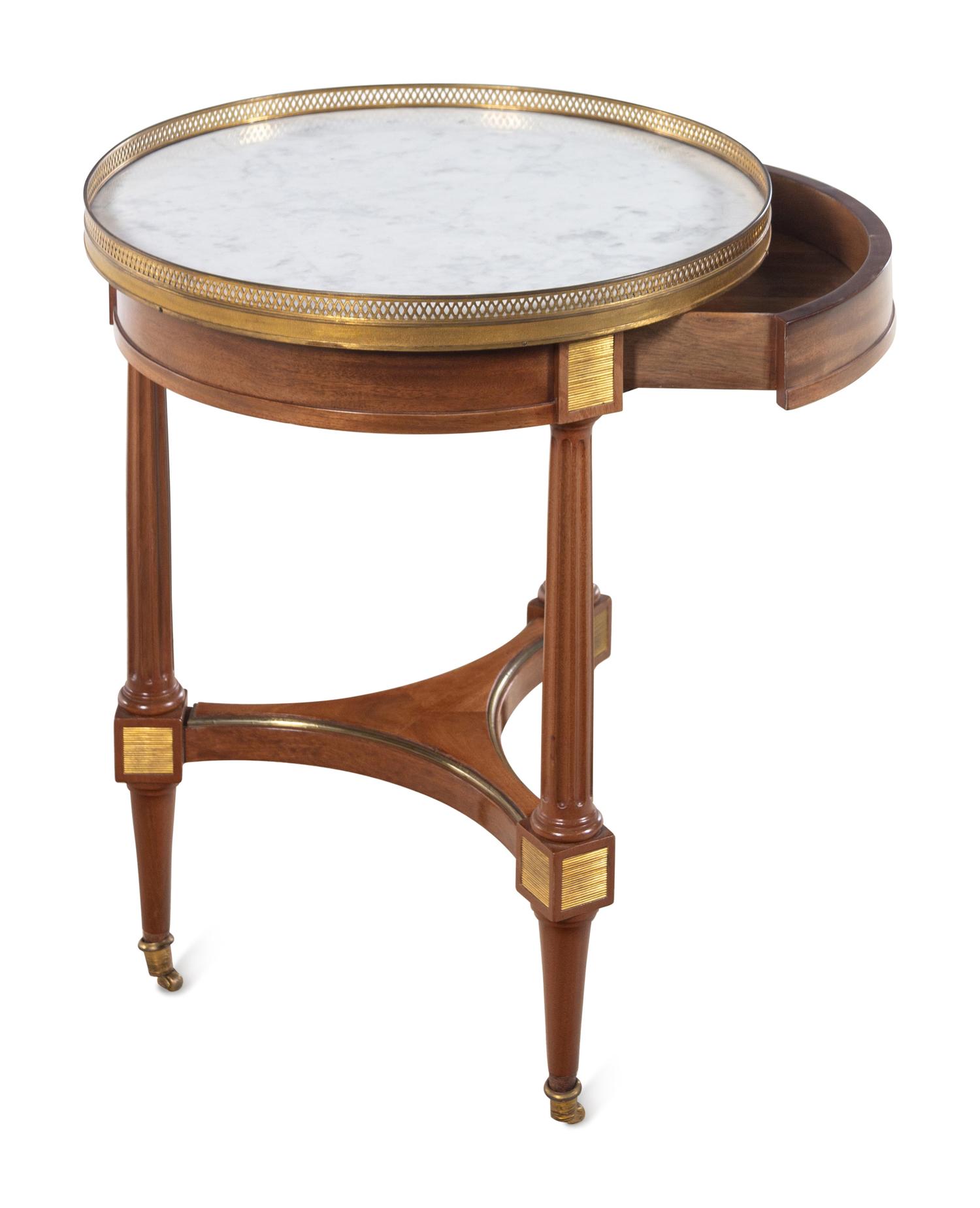 A Louis XVI Style Gilt Metal Mounted Mahogany Marble-Top Bouillotte Table