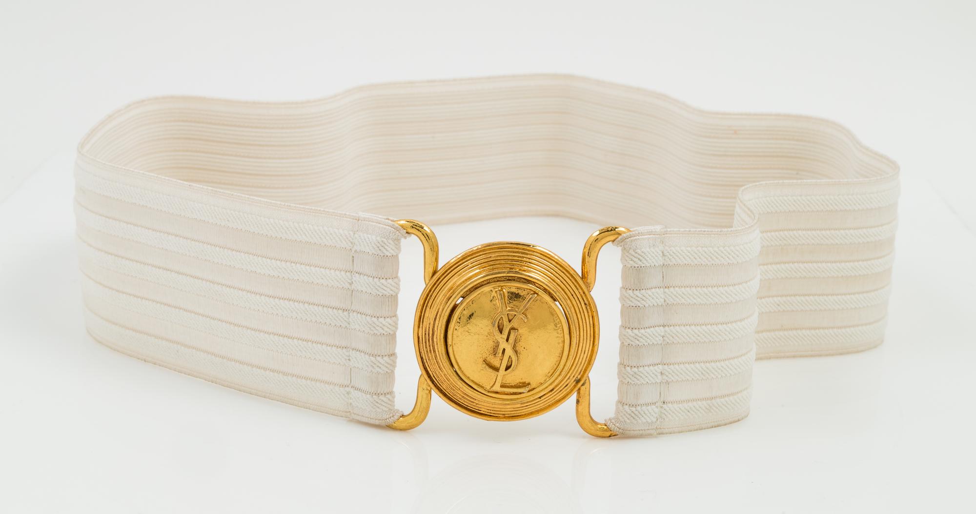 An Yves Saint Laurent White Stretch Belt, 34" x 2.25".