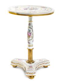 A Continental Porcelain Occasional Table, Height 21 x diameter 15 inches.