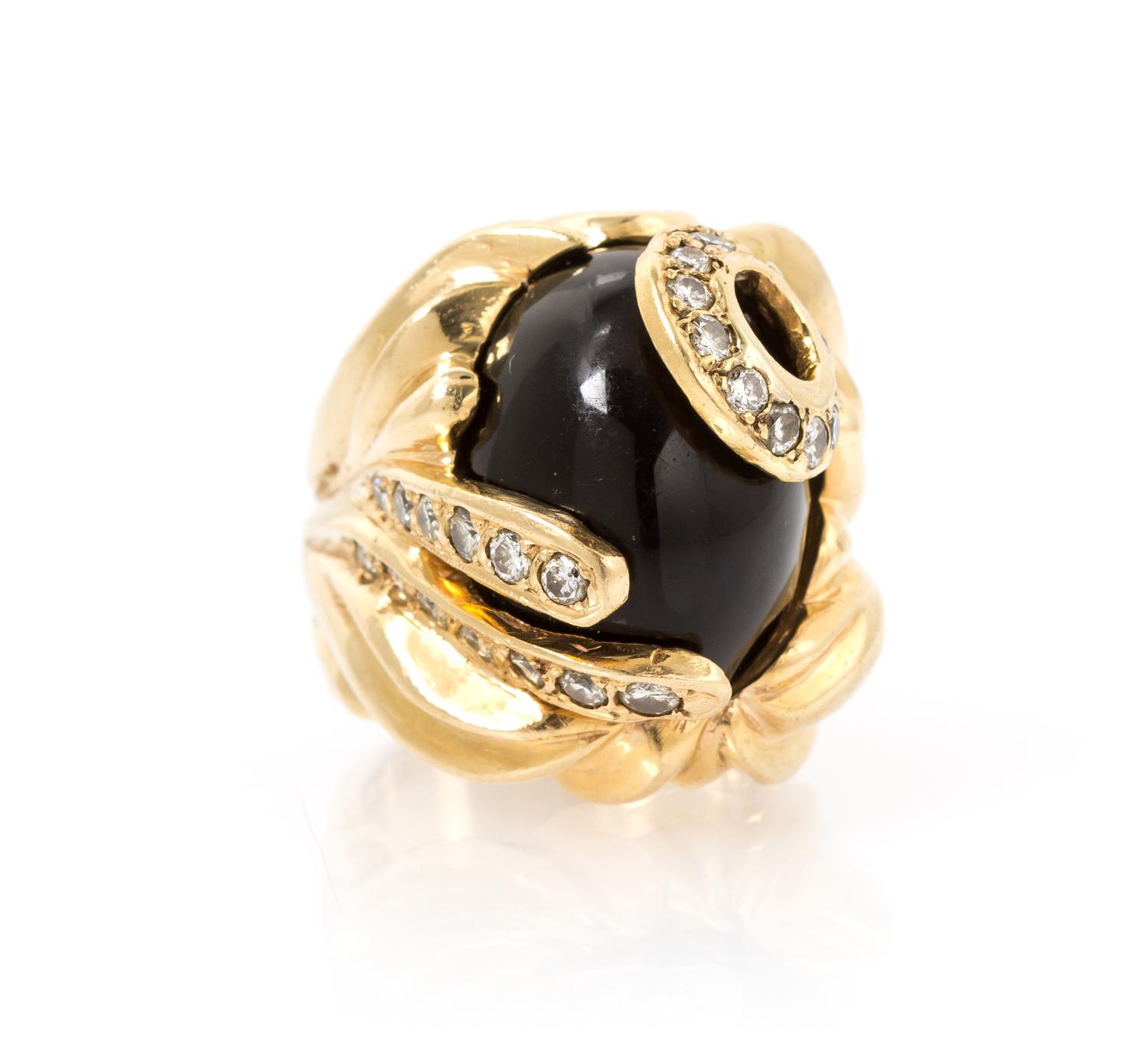 A 14 Karat Yellow Gold, Onyx and Diamond Ring, 23.00 dwts.