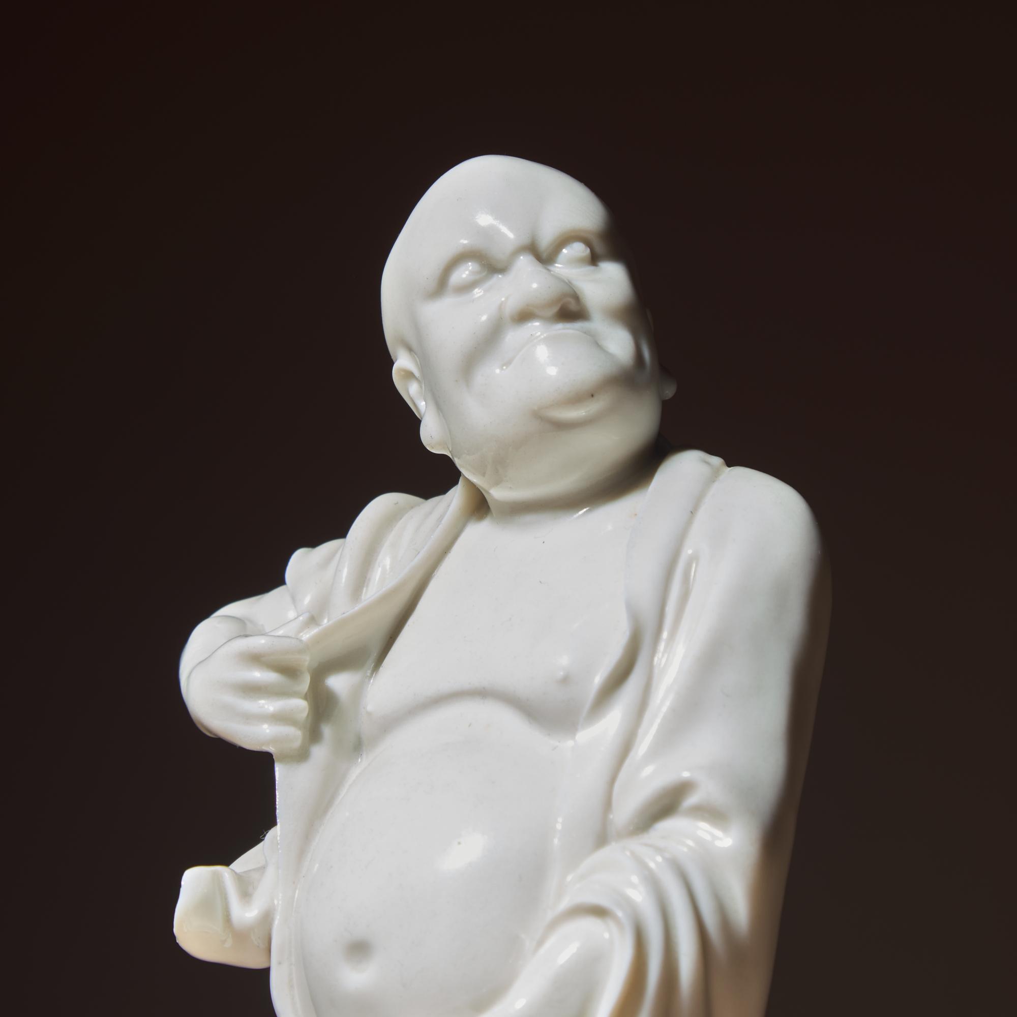 A Chinese Blanc-de-Chine Porcelain Standing Figure of a Luohan, Qing Dynasty — 清 德化白瓷羅漢立像