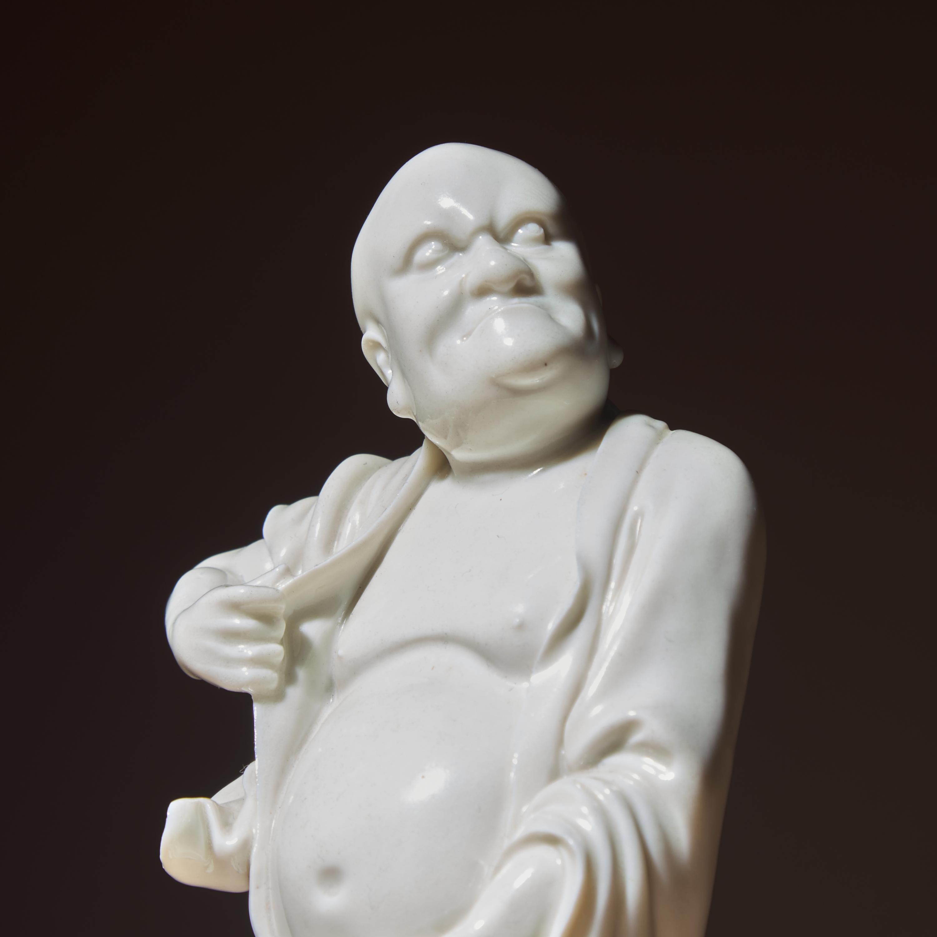 A Chinese Blanc-de-Chine Porcelain Standing Figure of a Luohan, Qing Dynasty — 清 德化白瓷羅漢立像