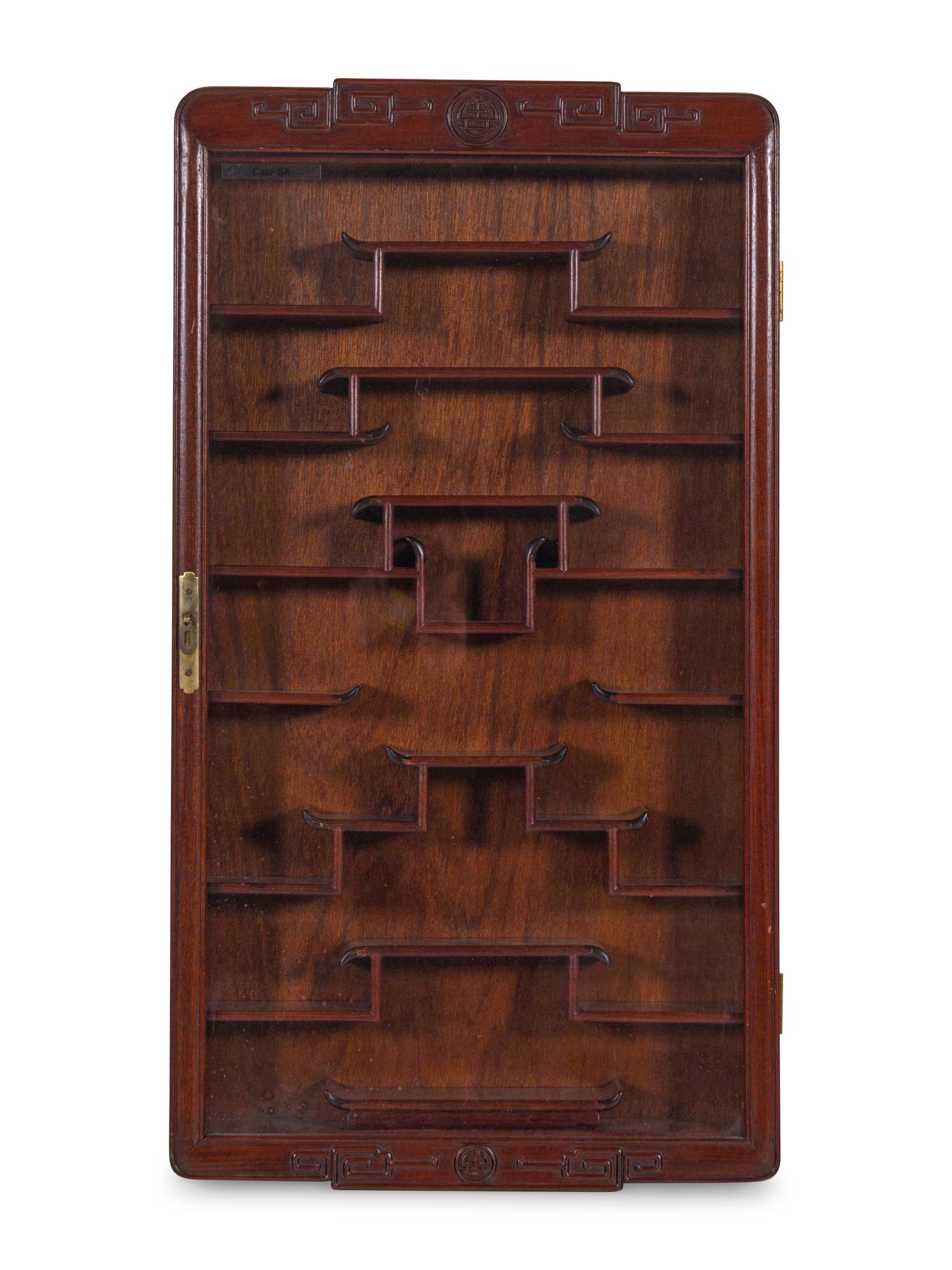A Pair of Chinese Carved Hardwood Vitrine Cabinets