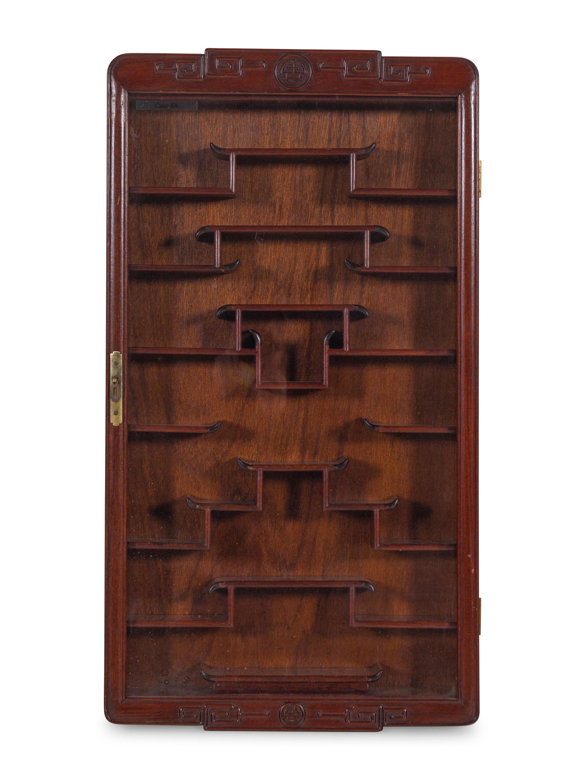 A Pair of Chinese Carved Hardwood Vitrine Cabinets