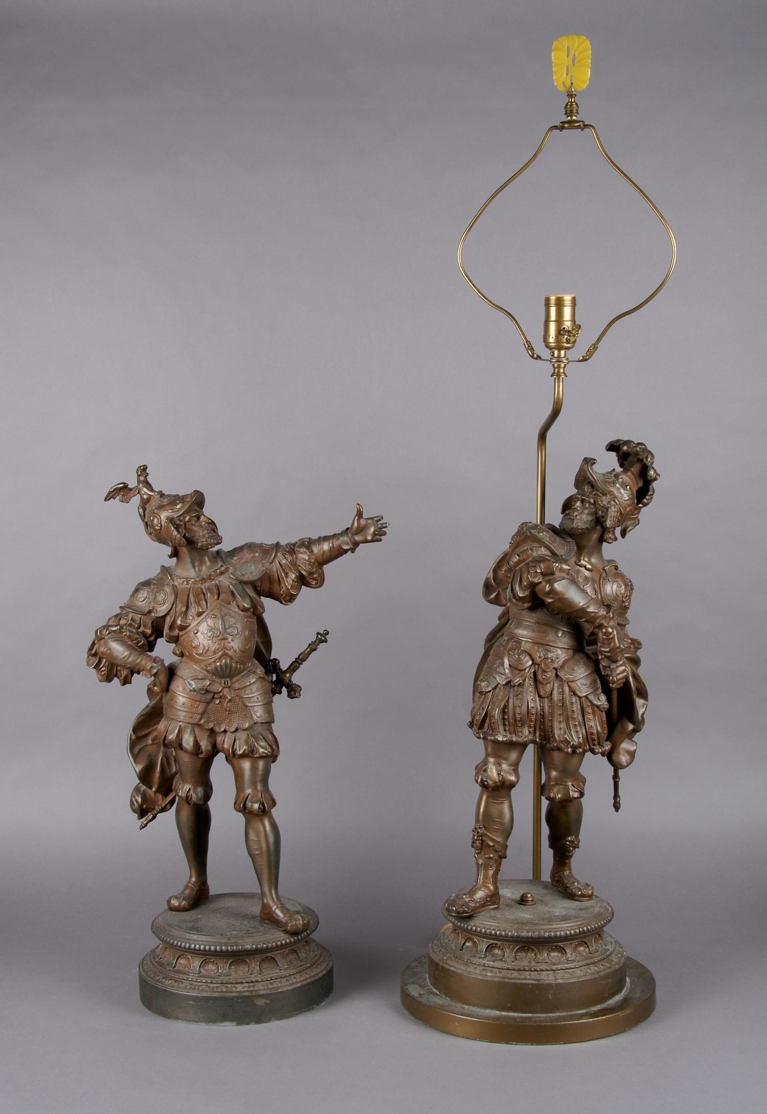 A Pair of Cast Metal Figures, Height 22 1/2 inches.