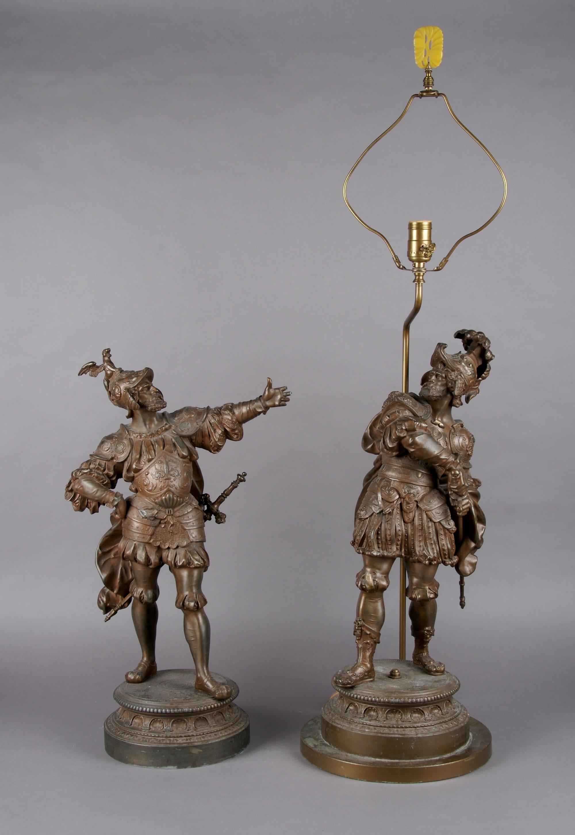 A Pair of Cast Metal Figures, Height 22 1/2 inches.