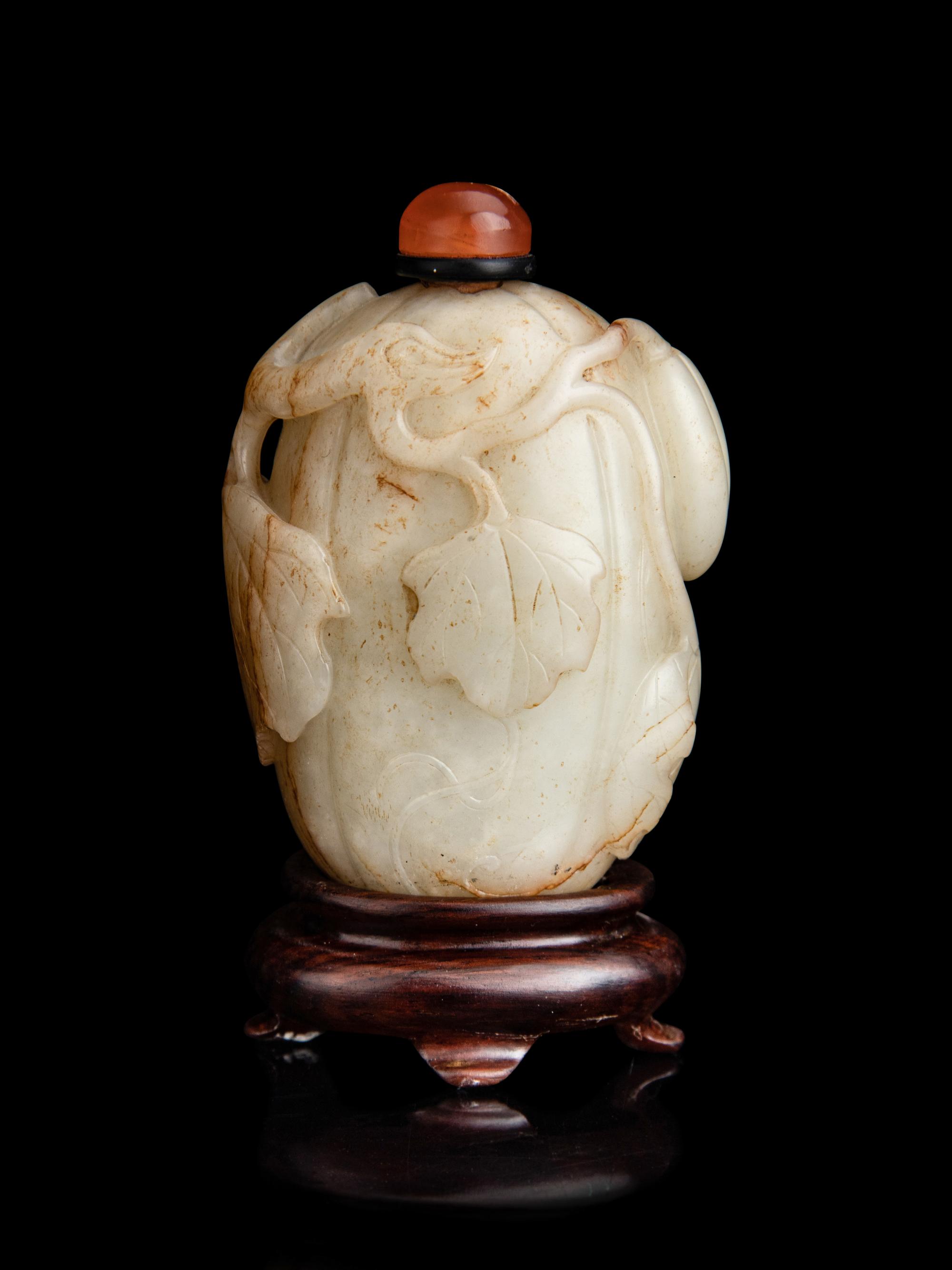 A Chinese White and Russet Jade Melon-Form Snuff Bottle
