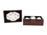 A Sèvres Painted and Parcel Gilt Porcelain Tea Service in a Mahogany and Marquetry Fitted Traveling Case