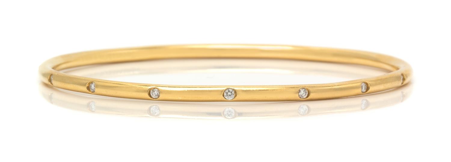 An 18 Karat Yellow Gold and Diamond Bangle Bracelet, Tiffany & Co., 11.80 dwts.