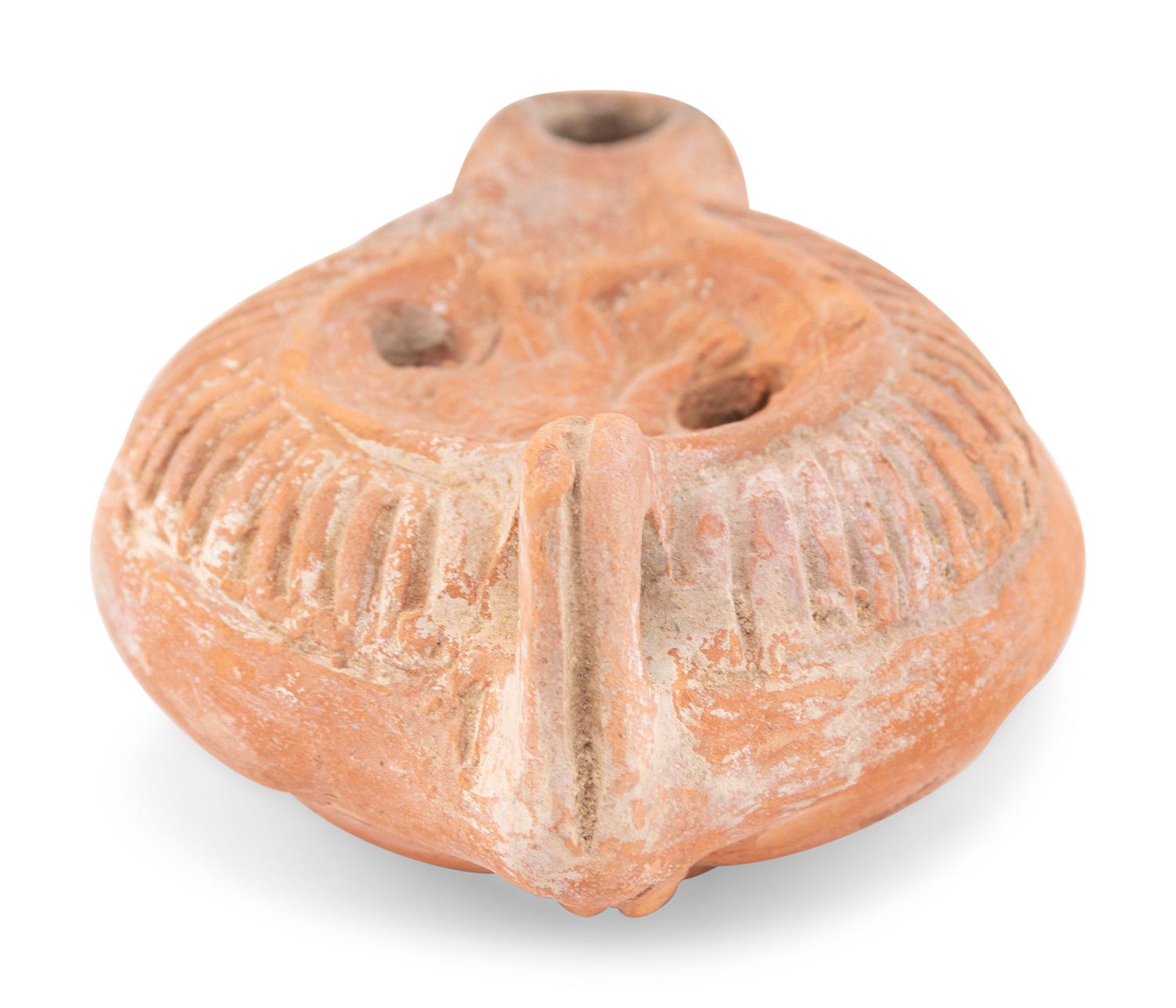A Roman Terracotta Discus Lamp Depicting the God Hermes