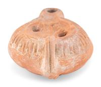 A Roman Terracotta Discus Lamp Depicting the God Hermes