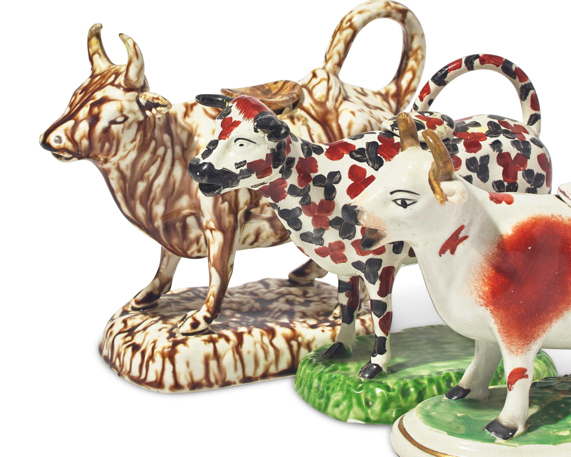 A Group of Three Staffordshire Cow-Form Creamers