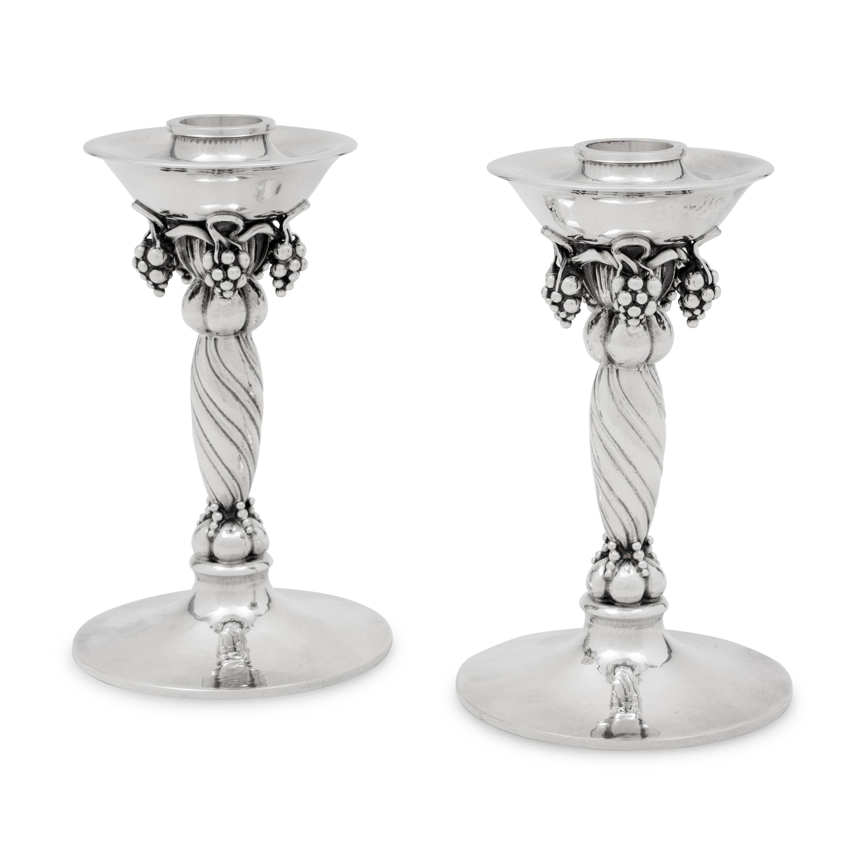 A Pair of Georg Jensen Silver Grape Candlesticks