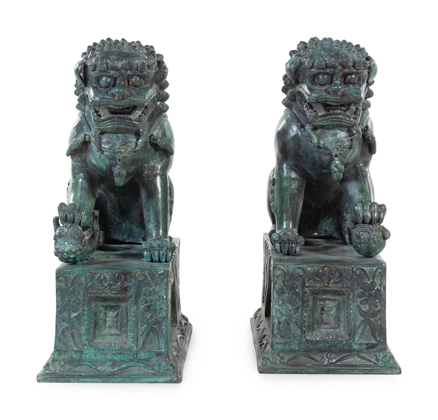 A Pair of Patinated Cast Metal Temple Guardians