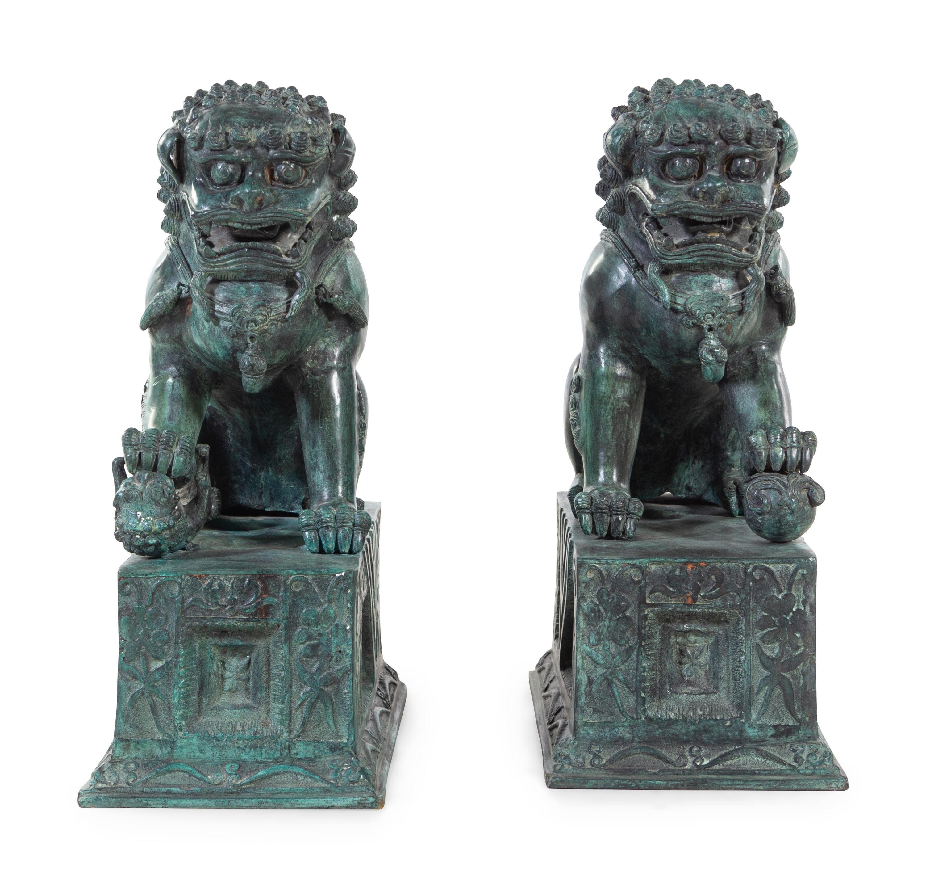 A Pair of Patinated Cast Metal Temple Guardians