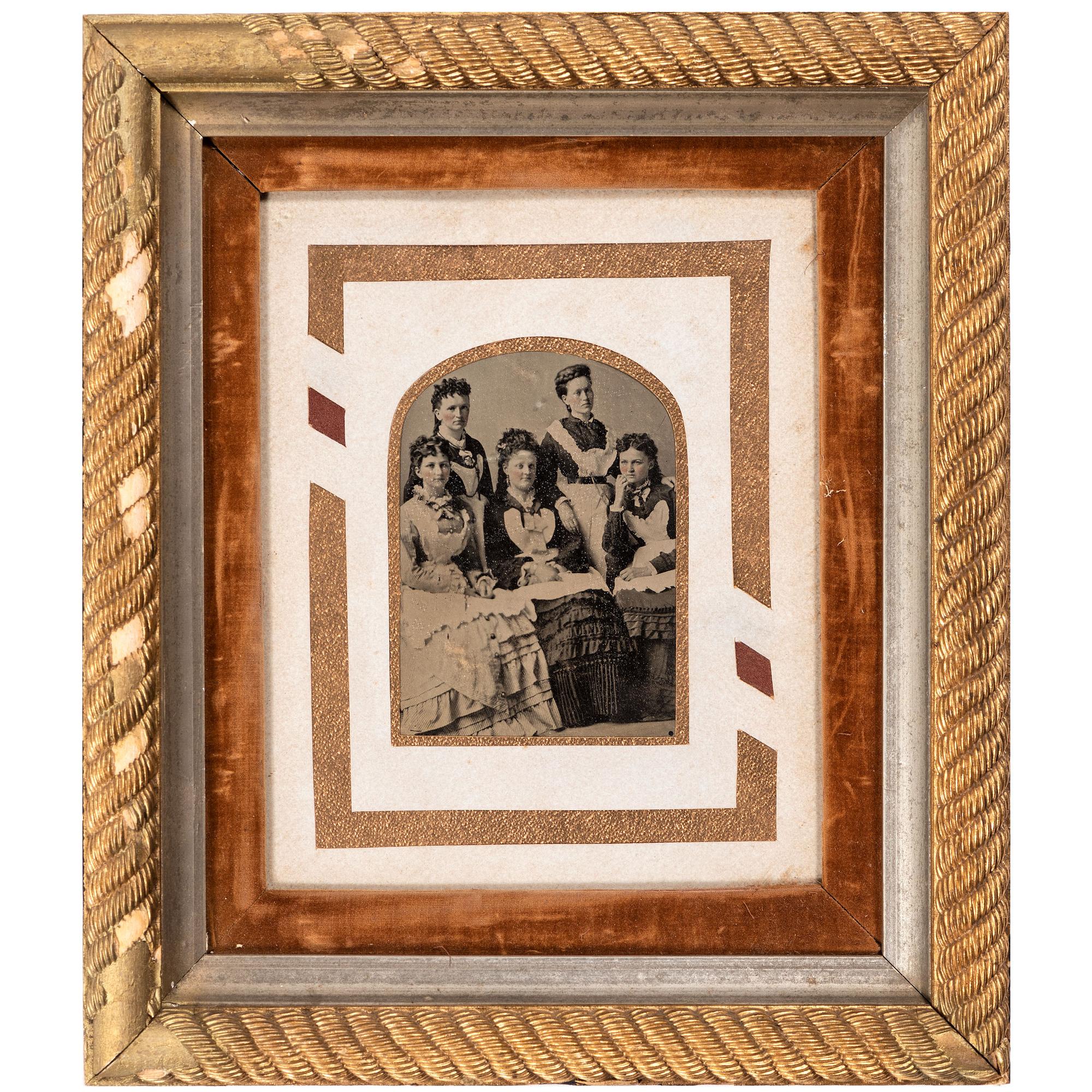 [EARLY PHOTOGRAPHY - PORTRAITURE]. A pair of framed tintypes of groups of people, comprising: