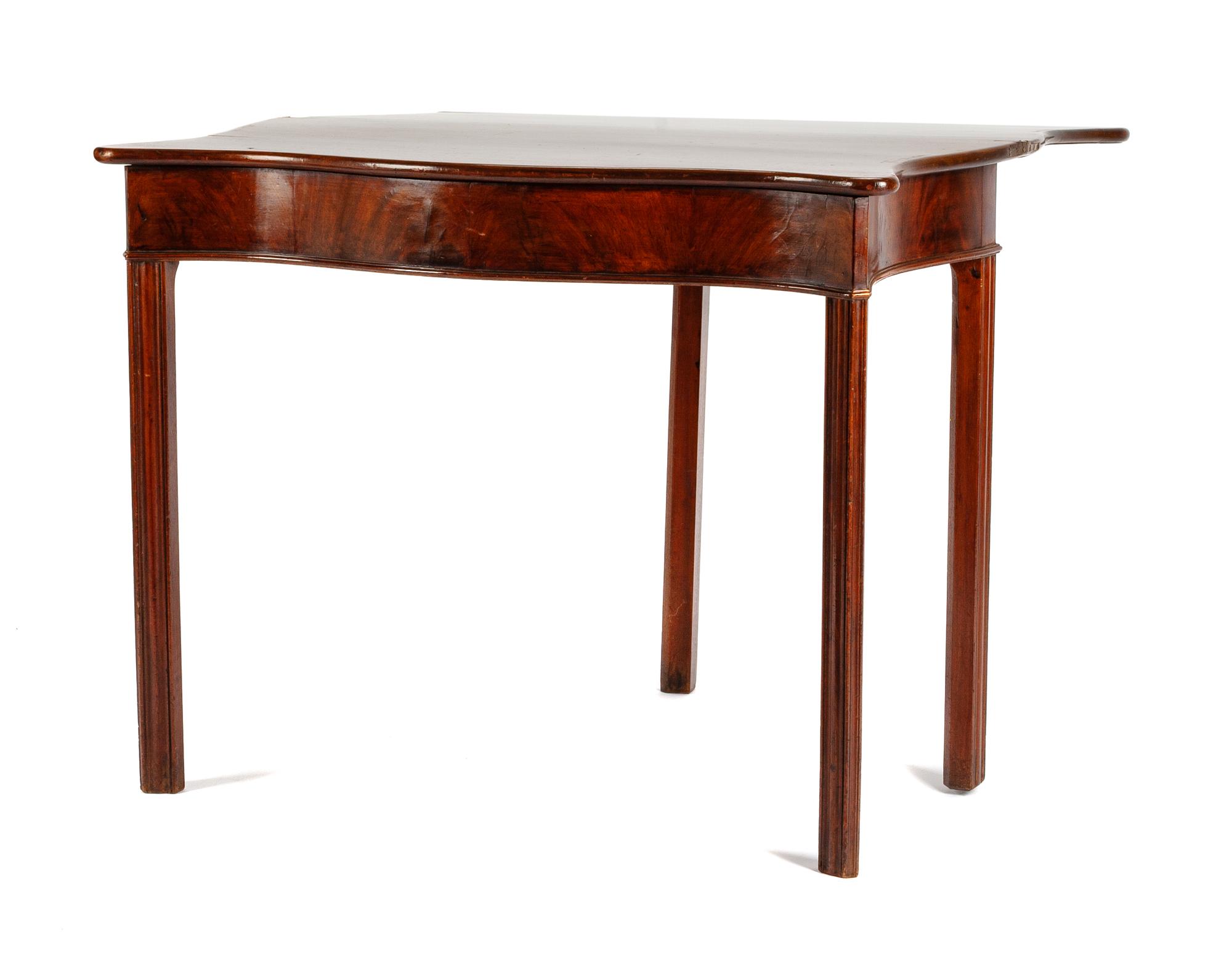 A Georgian Style Mahogany Flip-Top Game Table Height 29 x width 36 x depth 18 inches (closed).