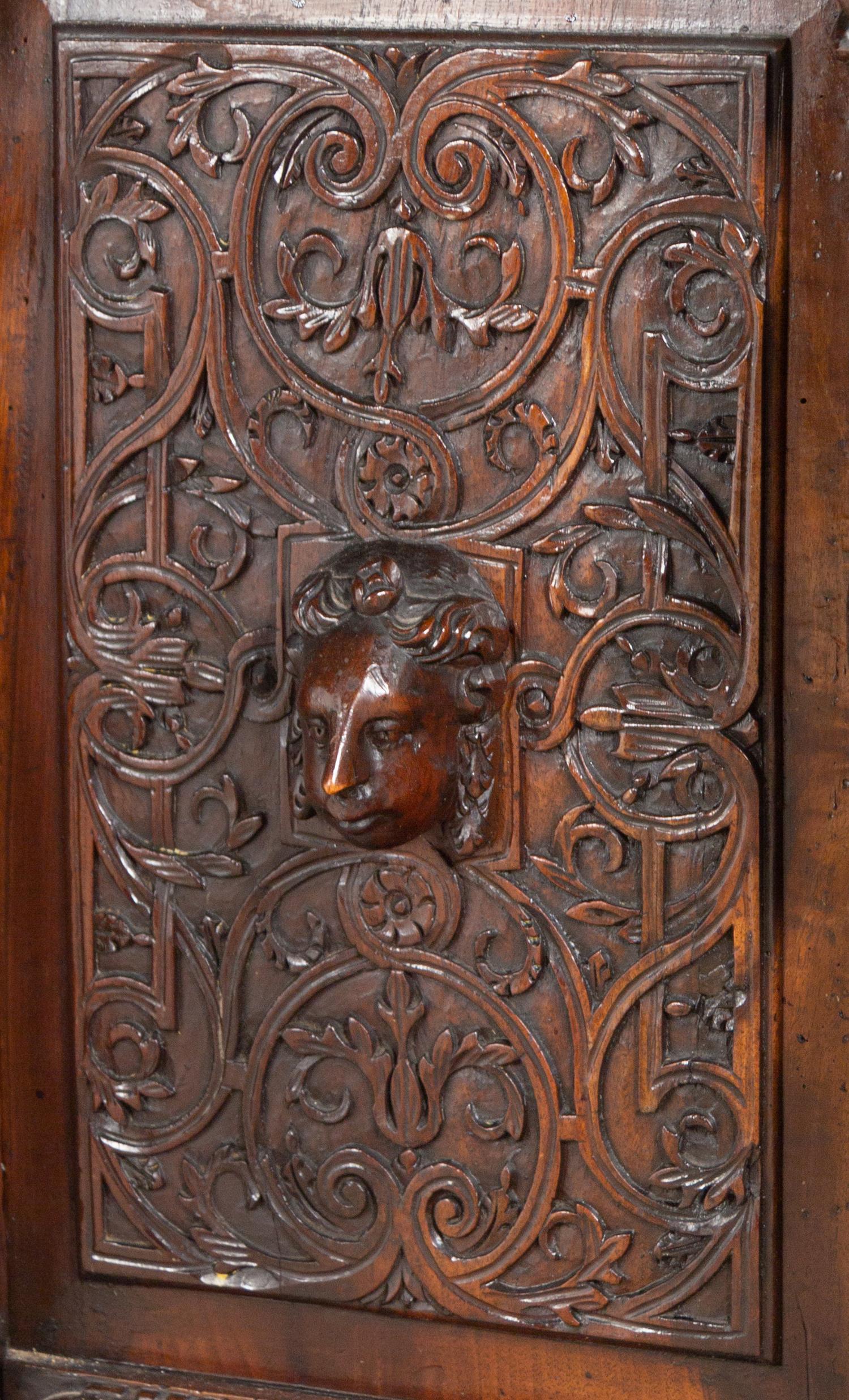 A Renaissance Revival Carved Walnut Marble-Top Cabinet