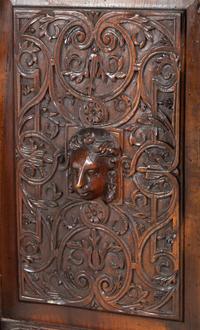 A Renaissance Revival Carved Walnut Marble-Top Cabinet