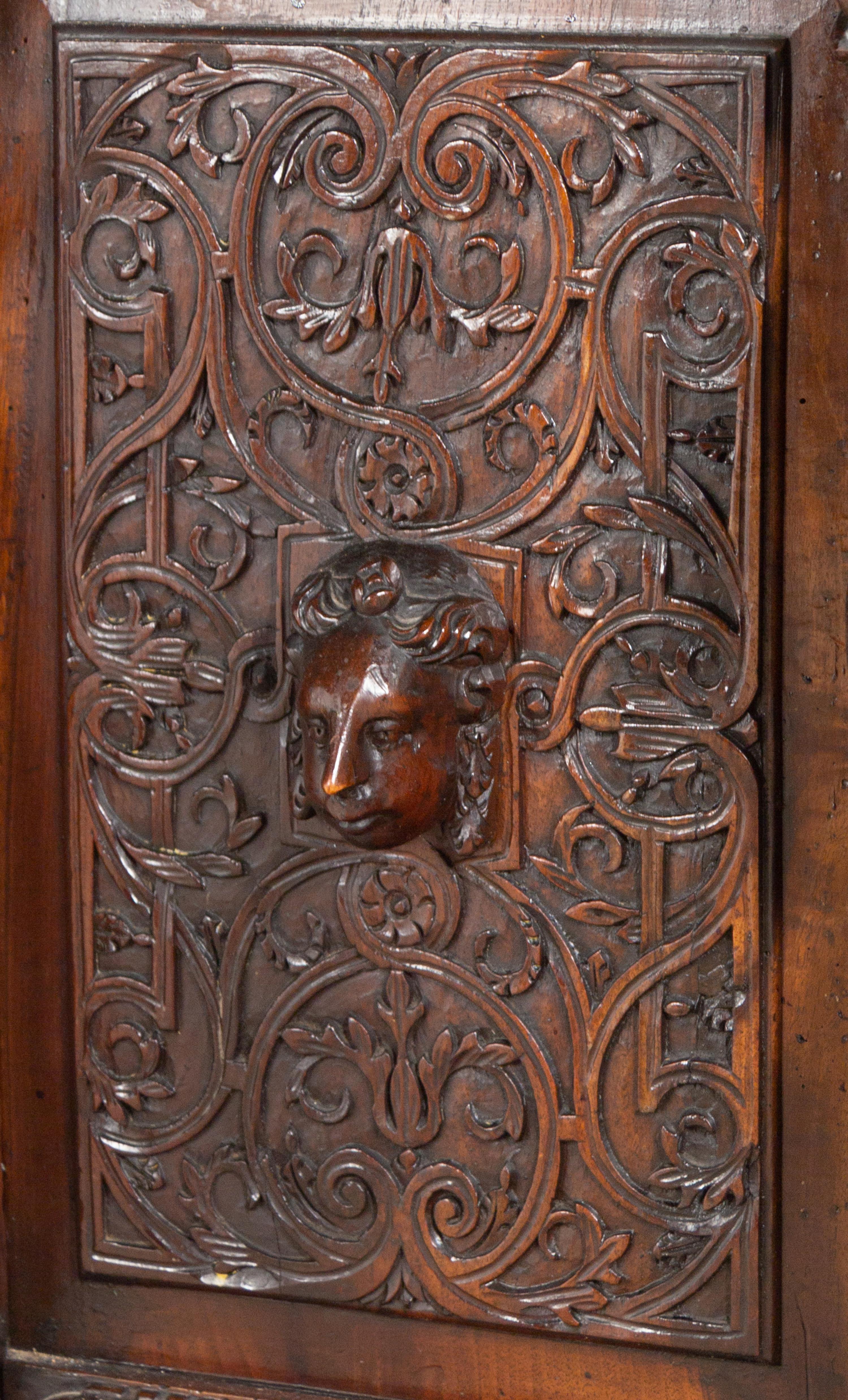 A Renaissance Revival Carved Walnut Marble-Top Cabinet