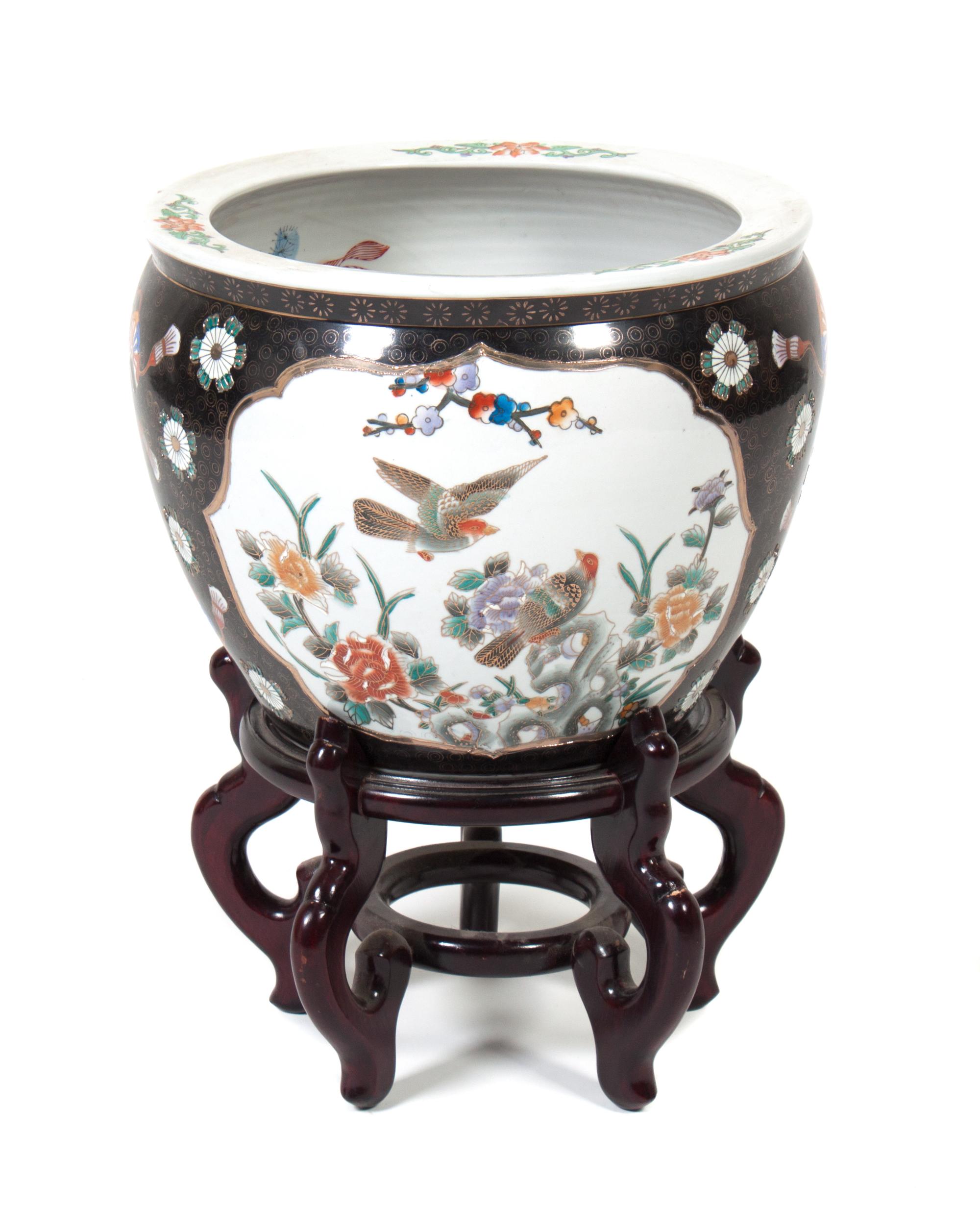 A Chinese Ceramic Fish Bowl Height 19 1/2 inches.