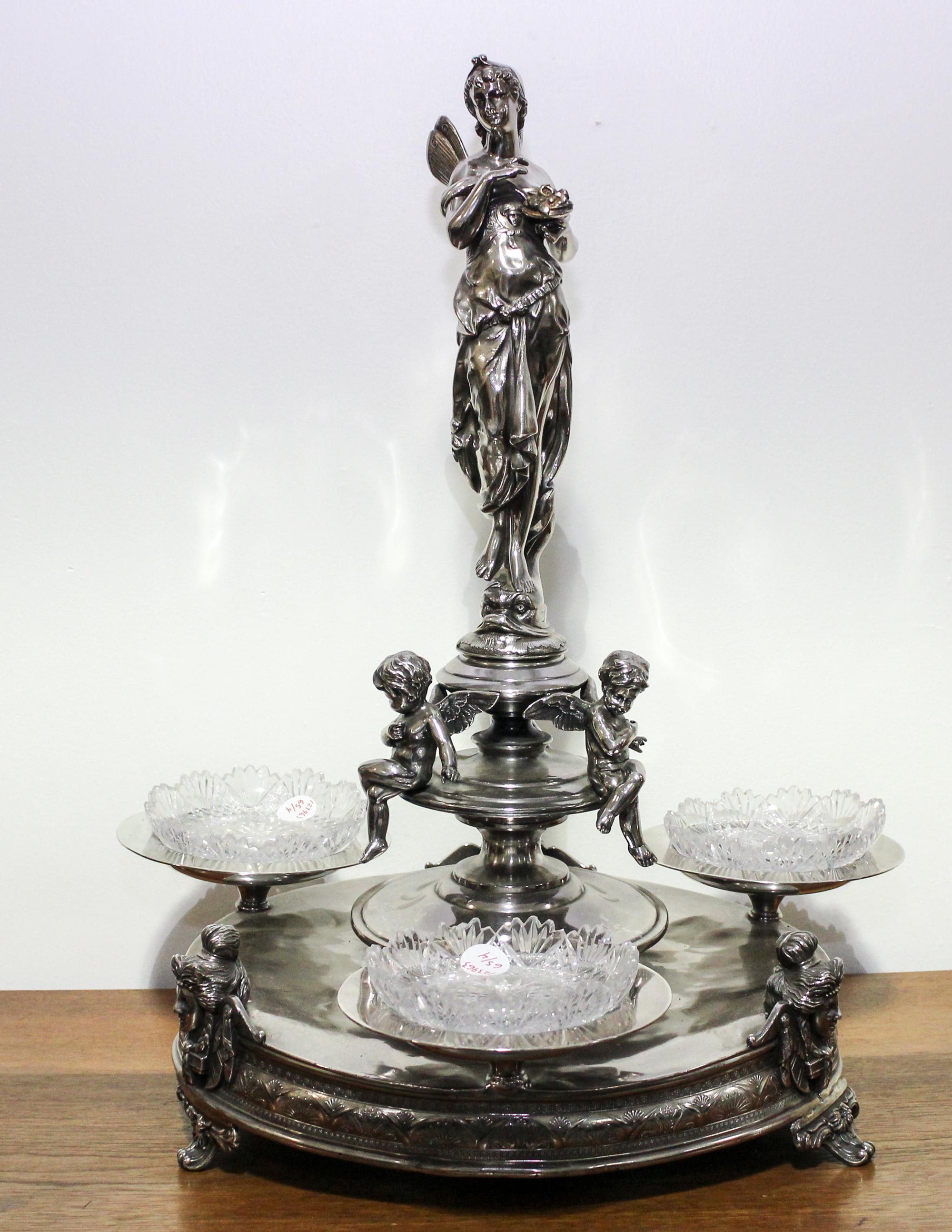 A Victorian Silver-Plate Centerpiece Height of 23 inches. — 19TH CENTURY