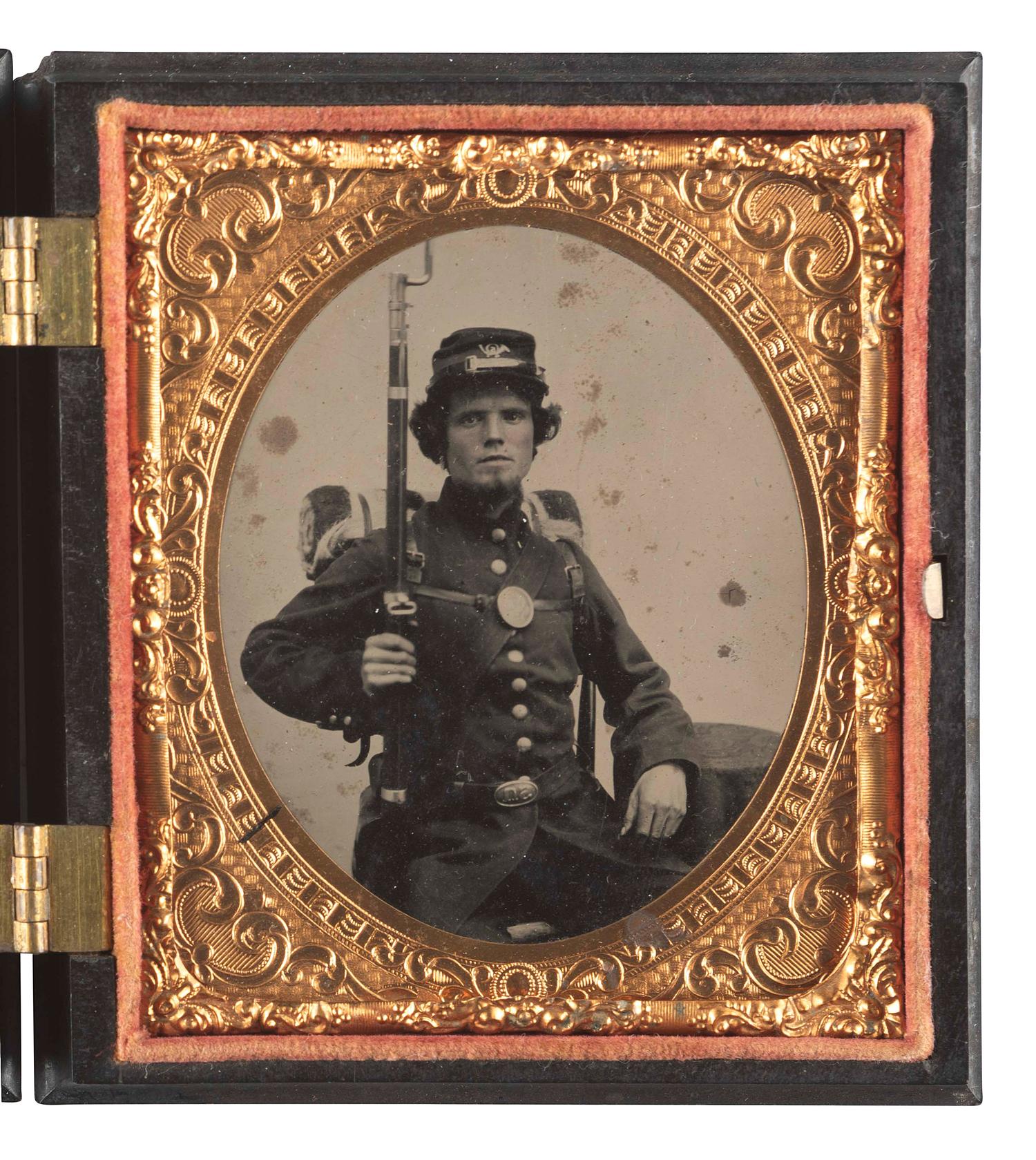 [CIVIL WAR]. Early war sixth plate tintype featuring a 5th Connecticut Infantry private holding his Springfield Rifle.