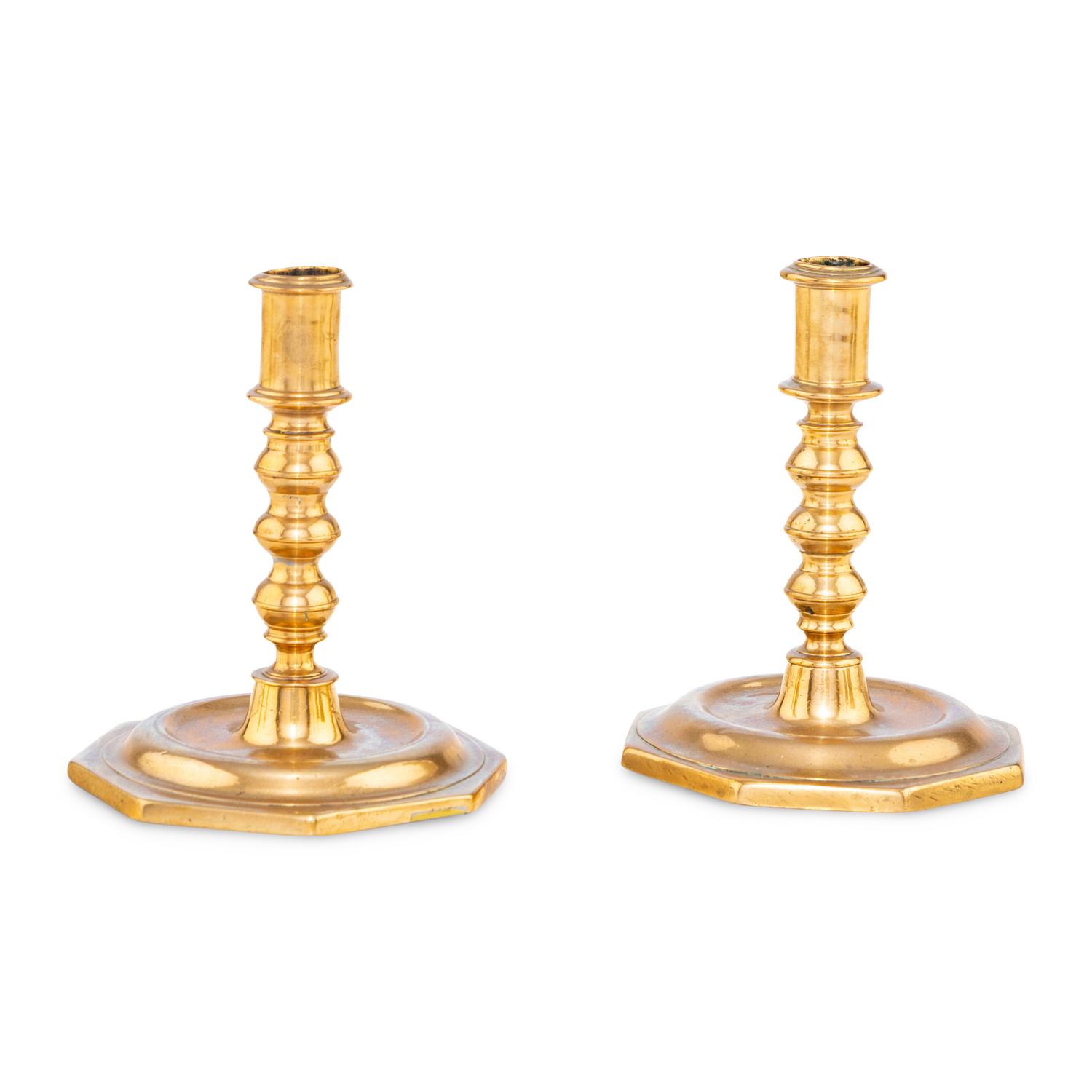 A Pair of Spanish Bell Metal Candlesticks