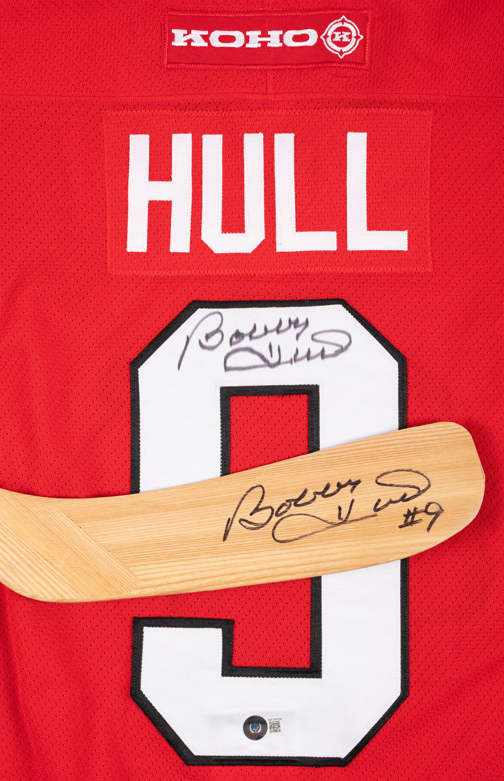 A Bobby Hull Signed Autograph Chicago Blackhawks Jersey and Hockey Stick (Beckett Authentication Services BAS Certfied),