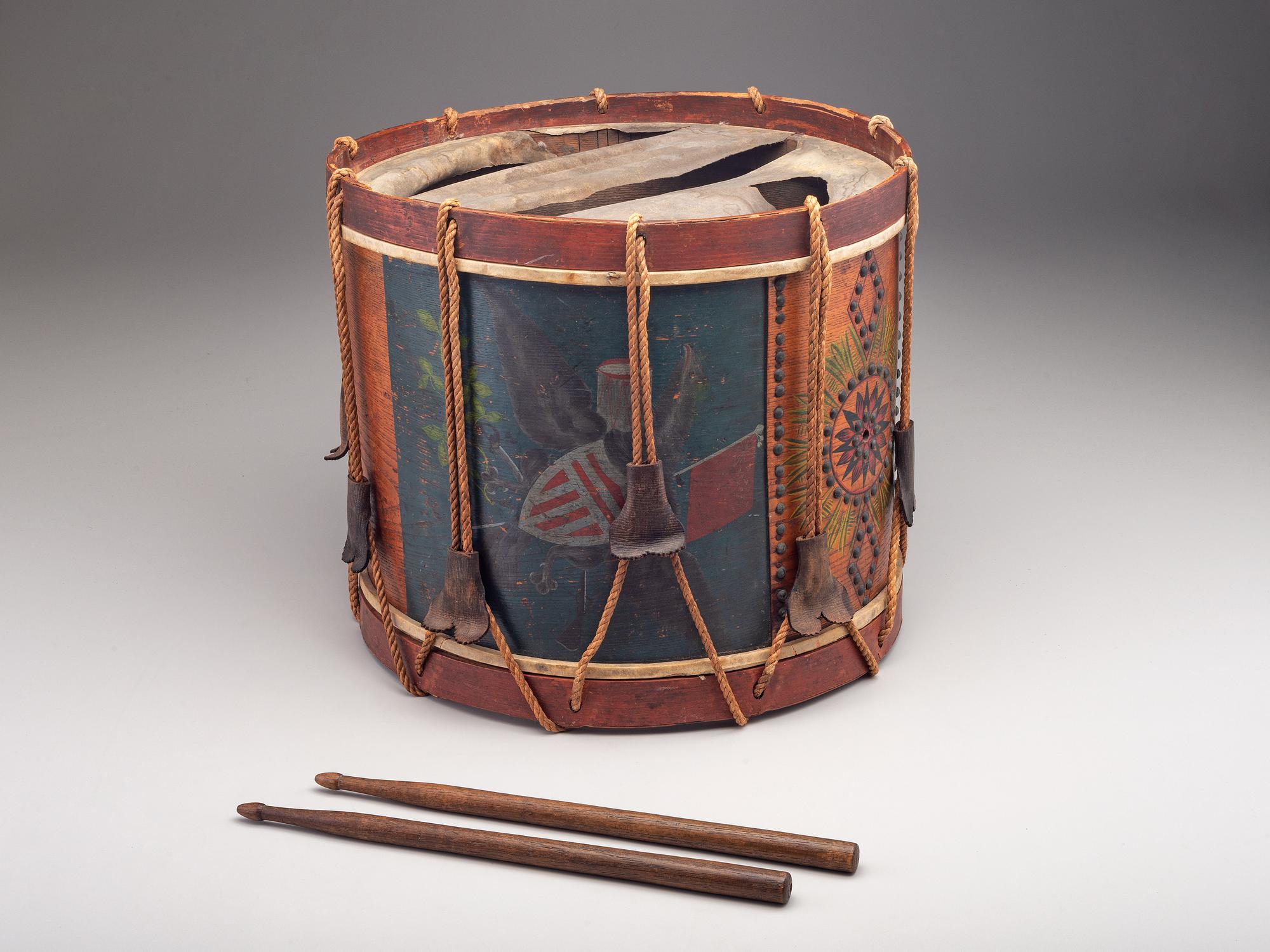 [MILITARIA]. Possibly Mexican War painted drum featuring ornate tack design, with drumsticks.