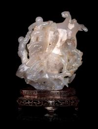 A Chinese Carved 'Boy and Pomegranate' Group