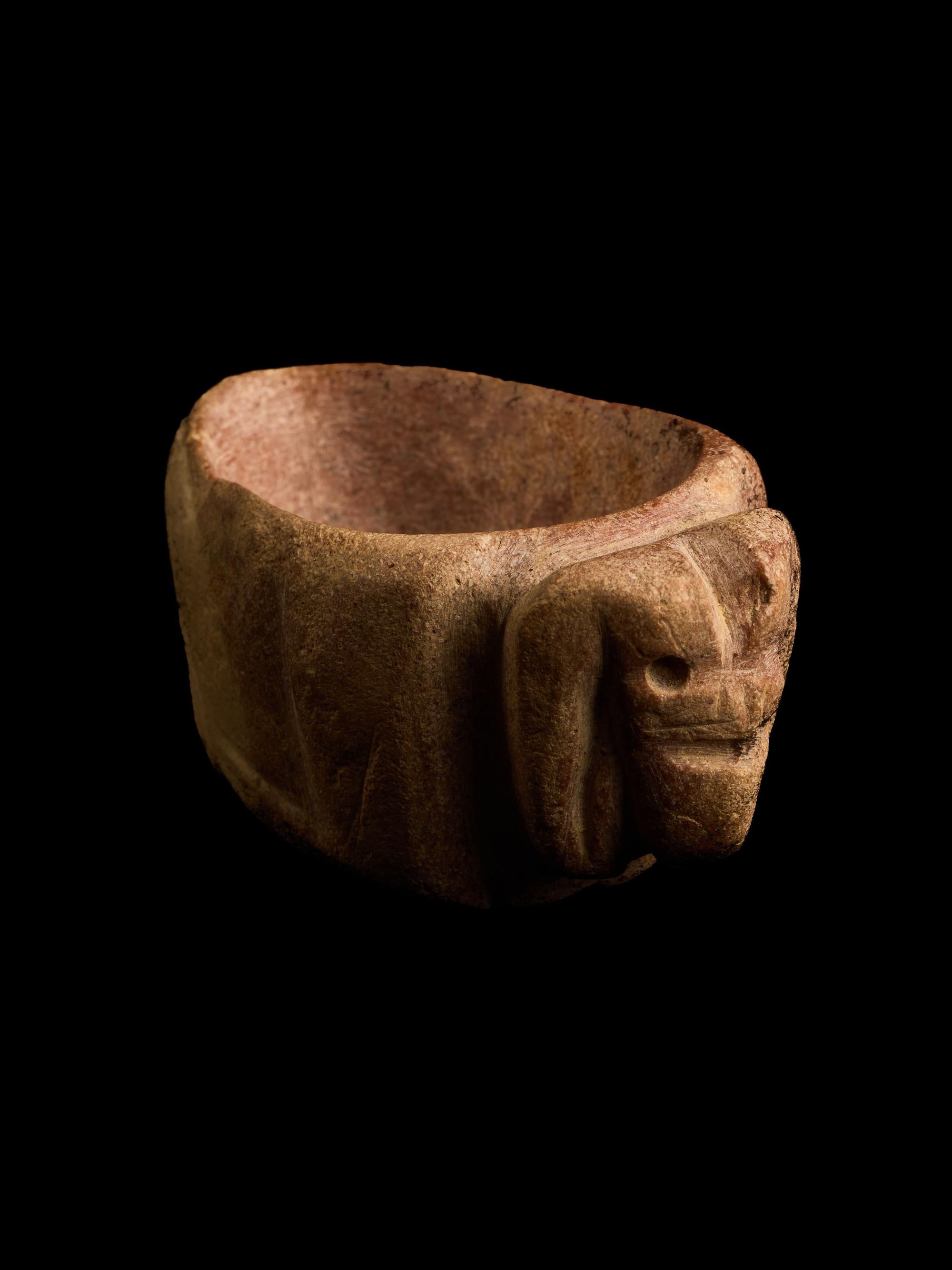 A Mesopotamian Red Marble Bowl in the Form of a Ram