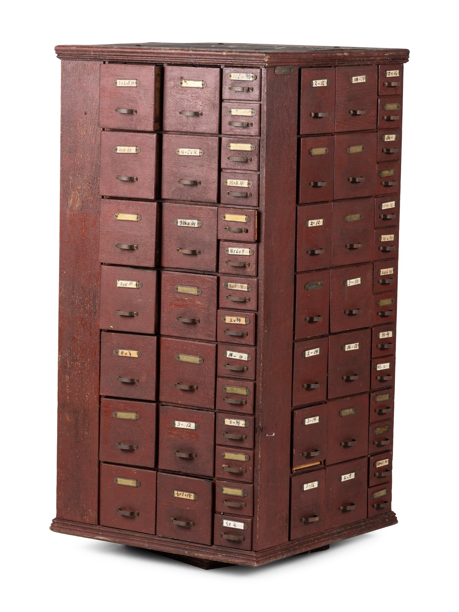 A Rotating Hardware Store Storage Cabinet in Red Paint